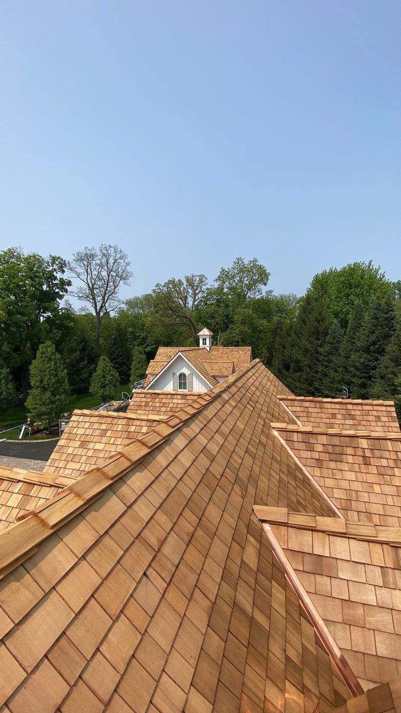 Cedar Shake Roof Replacement with Half Round Gutter Installation by Custom Installations, Inc.