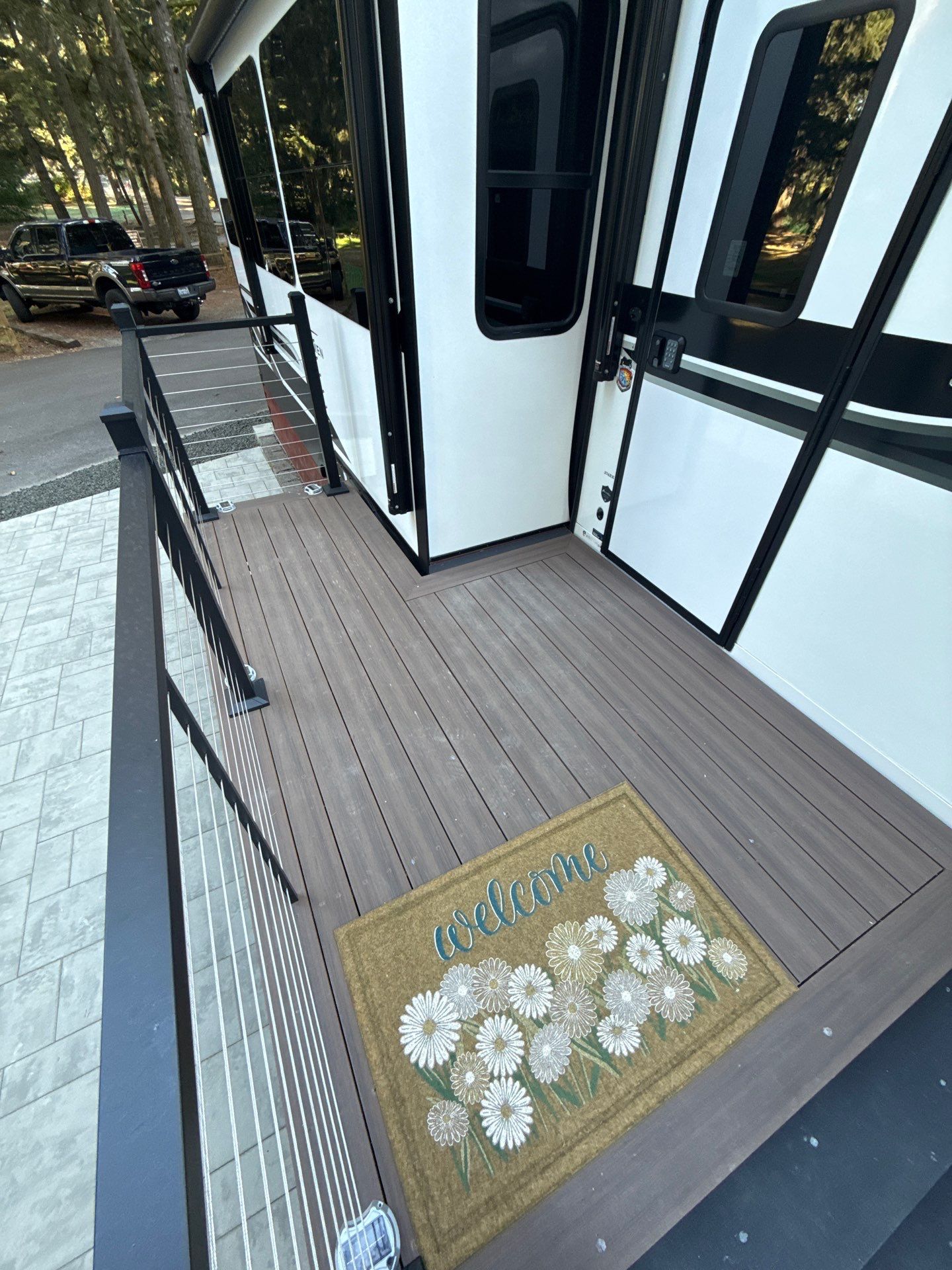 Custom Composite Deck with Cable Railing and Paver Patio in Olympia by Expedeck