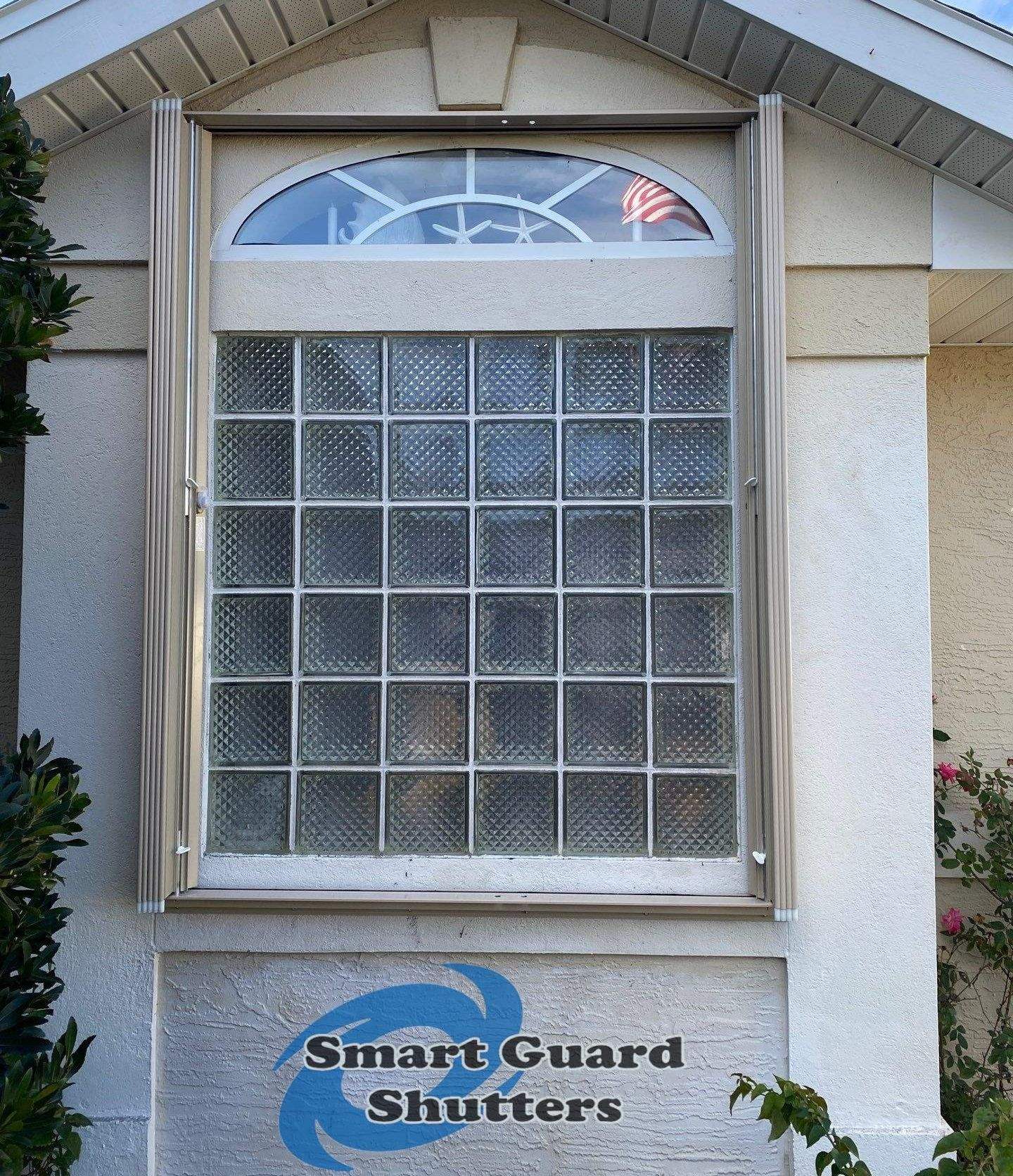 Accordion Shutters in Beige by Smart Guard Shutters