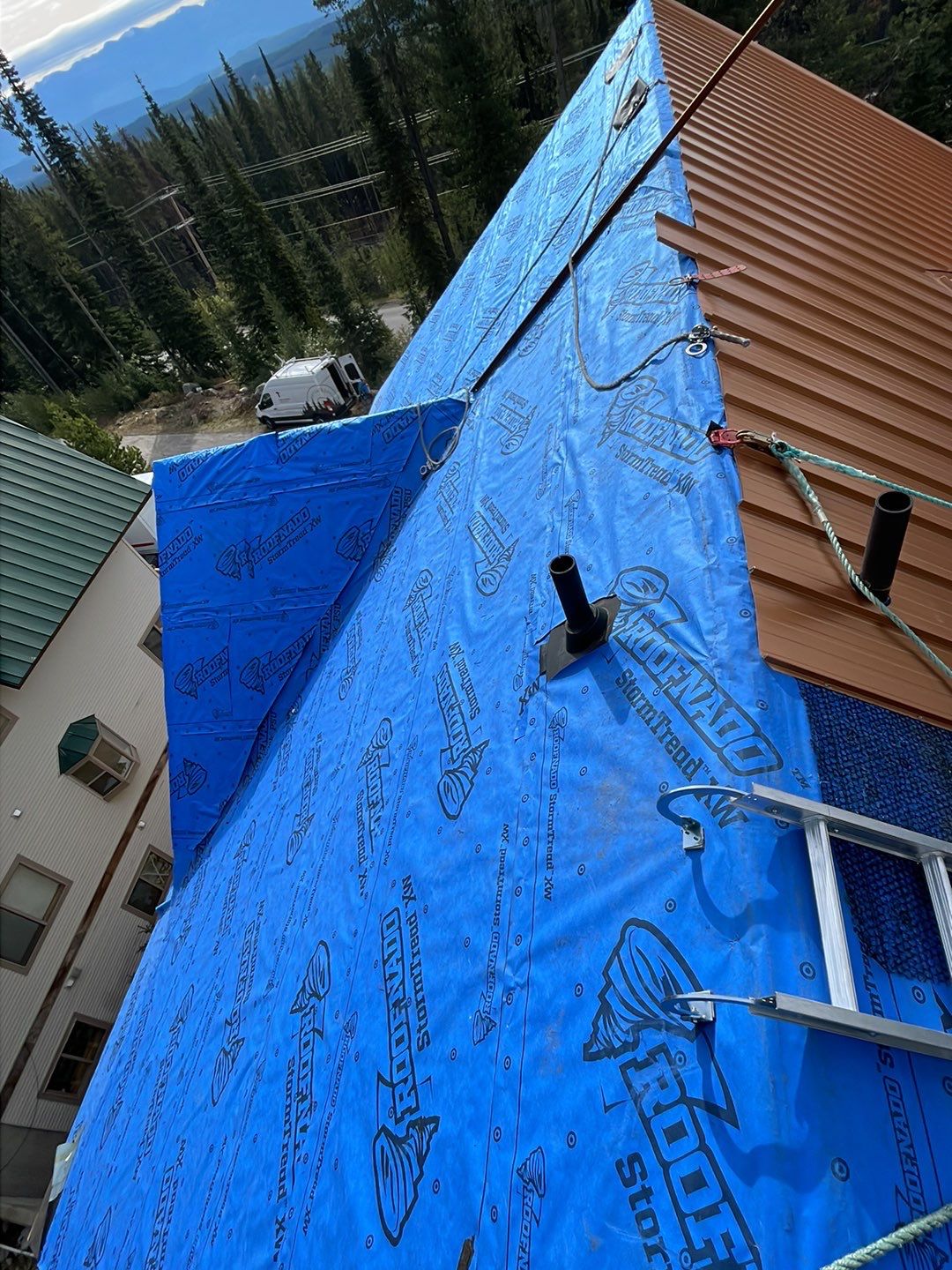 Residential Roofing Installation using 12" Prolok metal  by Top Notch Roofing Inc
