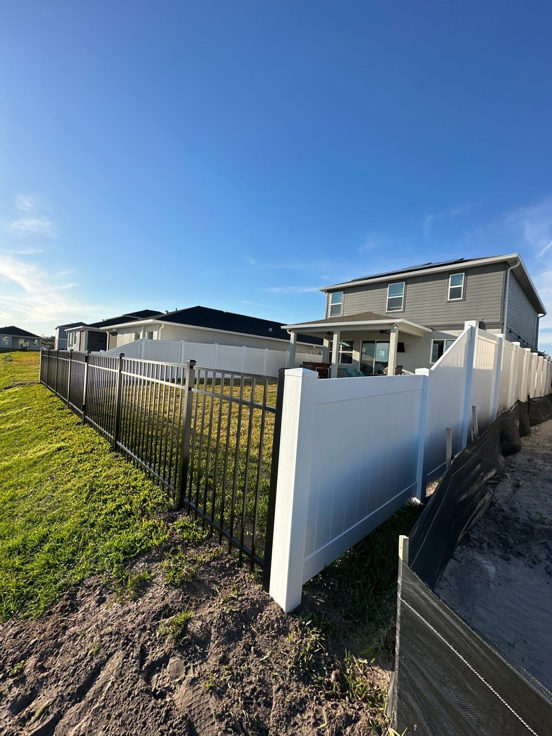 Vinyl Fence Installation using Black 3 Rail Aluminum and Vinyl Privacy Fence  by Asap fence and gates, LLC