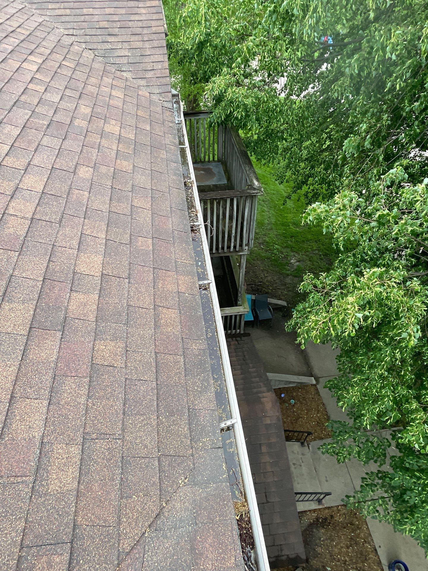 Commercial gutter cleaning Champaign & Urbana before photo with filled gutters