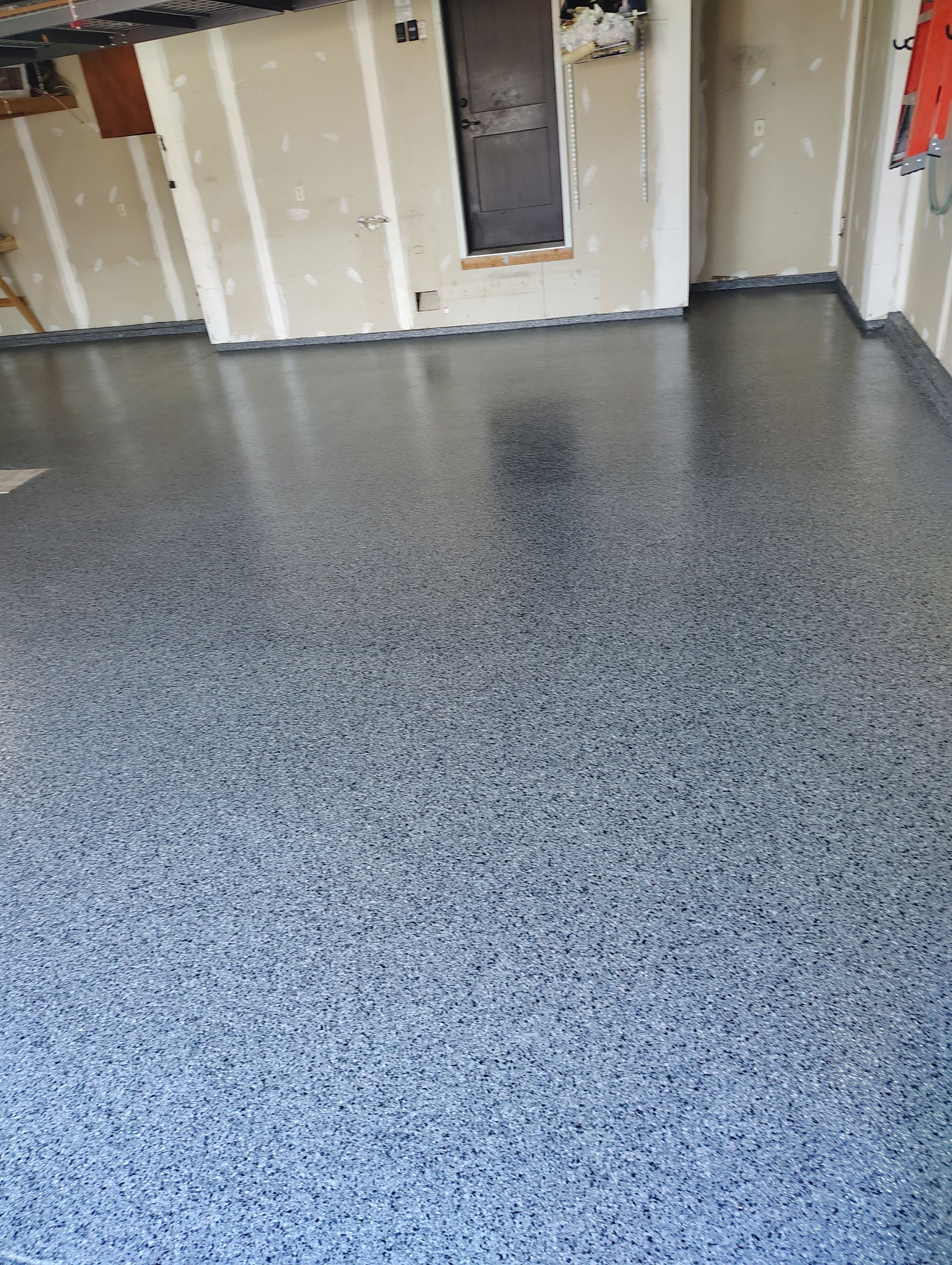Sioux Falls Garage Concrete Grinding and Nightfall Decorative Chip Coating by Select Painting, Coatings & Garage Cabinets