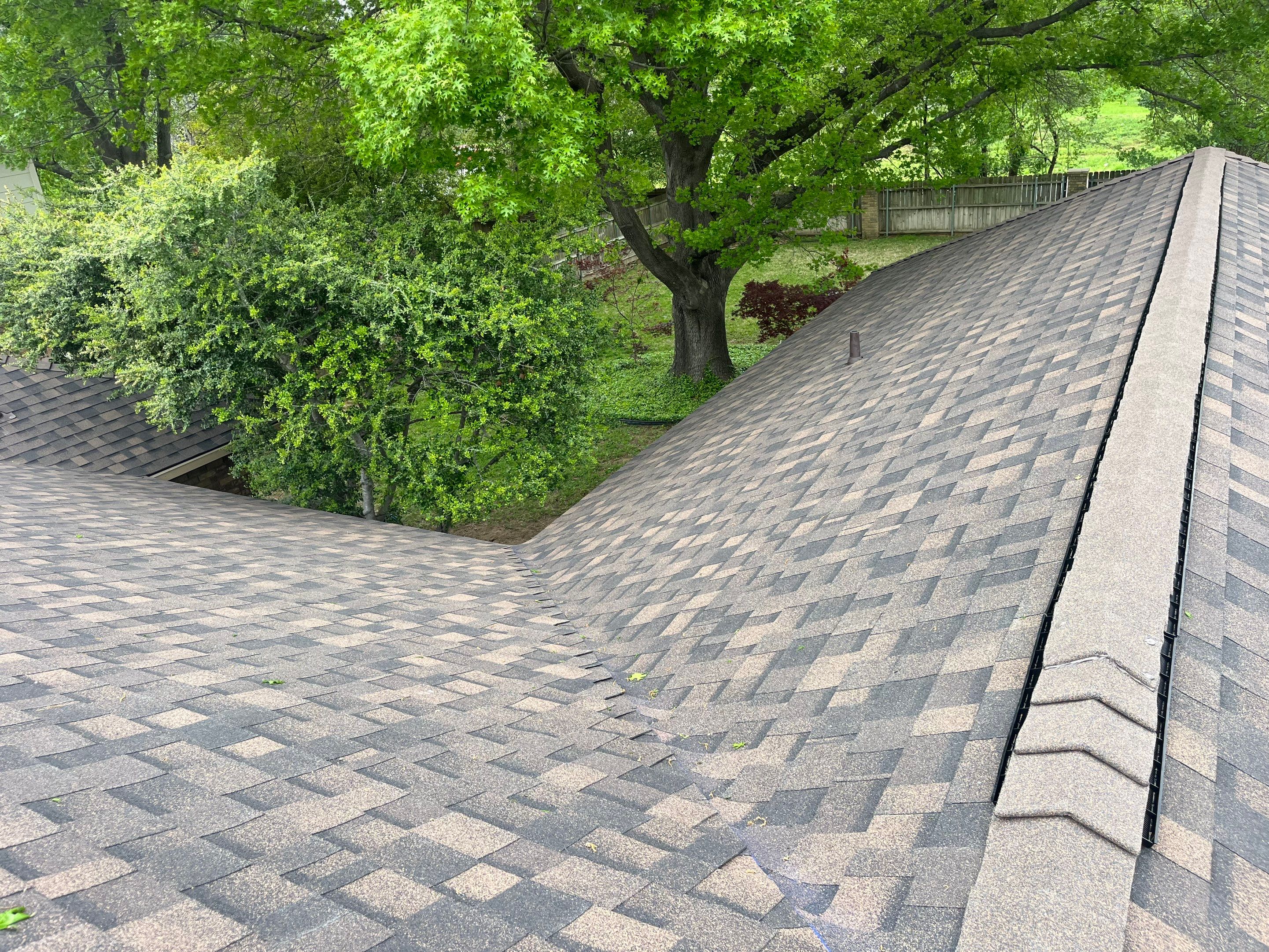 Brown brick with IKO Shadow Brown by Tejas Roofworks + Restoration