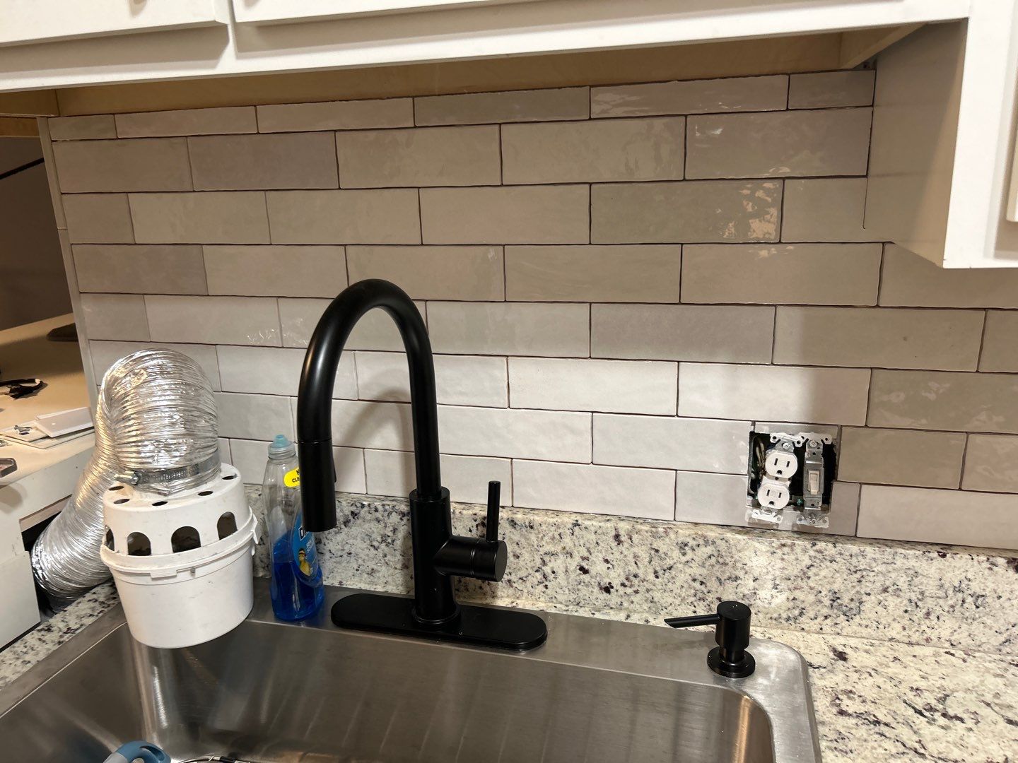 Brick pattern tiles for a bathroom and kitchen by Footprints Floors of Nashville