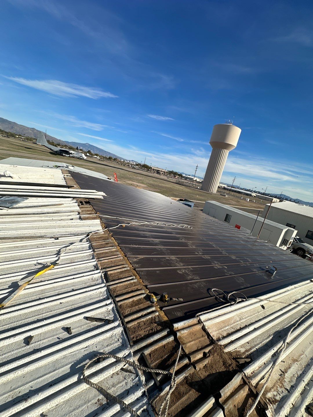 Burnished Exposed Fastener by Reimagine Roofing
