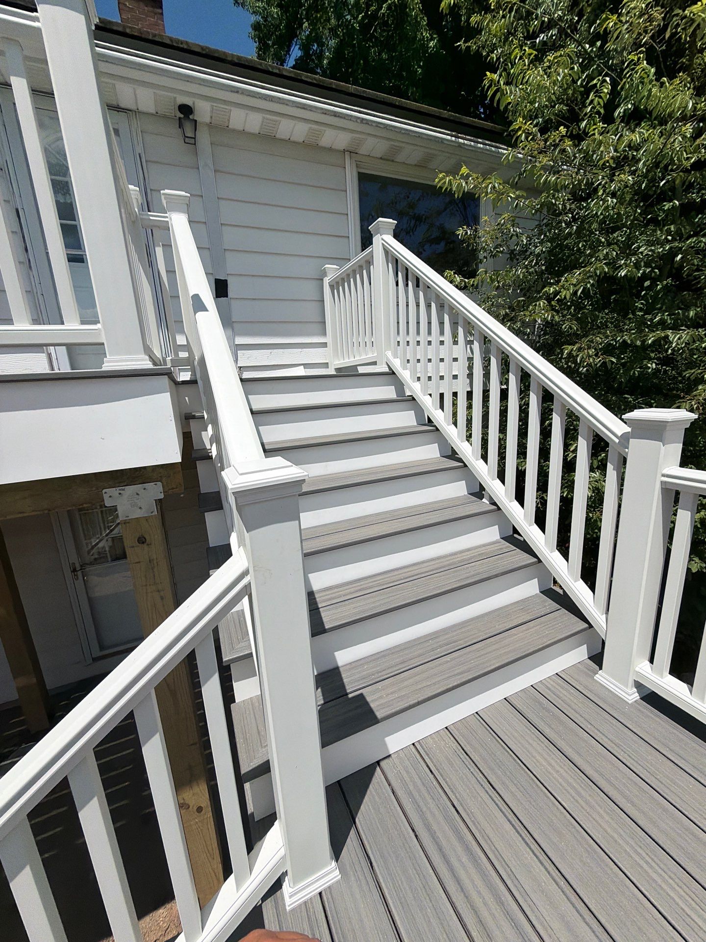 Deck Replacement using Trex tropical Island mist and transcend white railing.  by DiGiorgi Roofing and Siding Inc