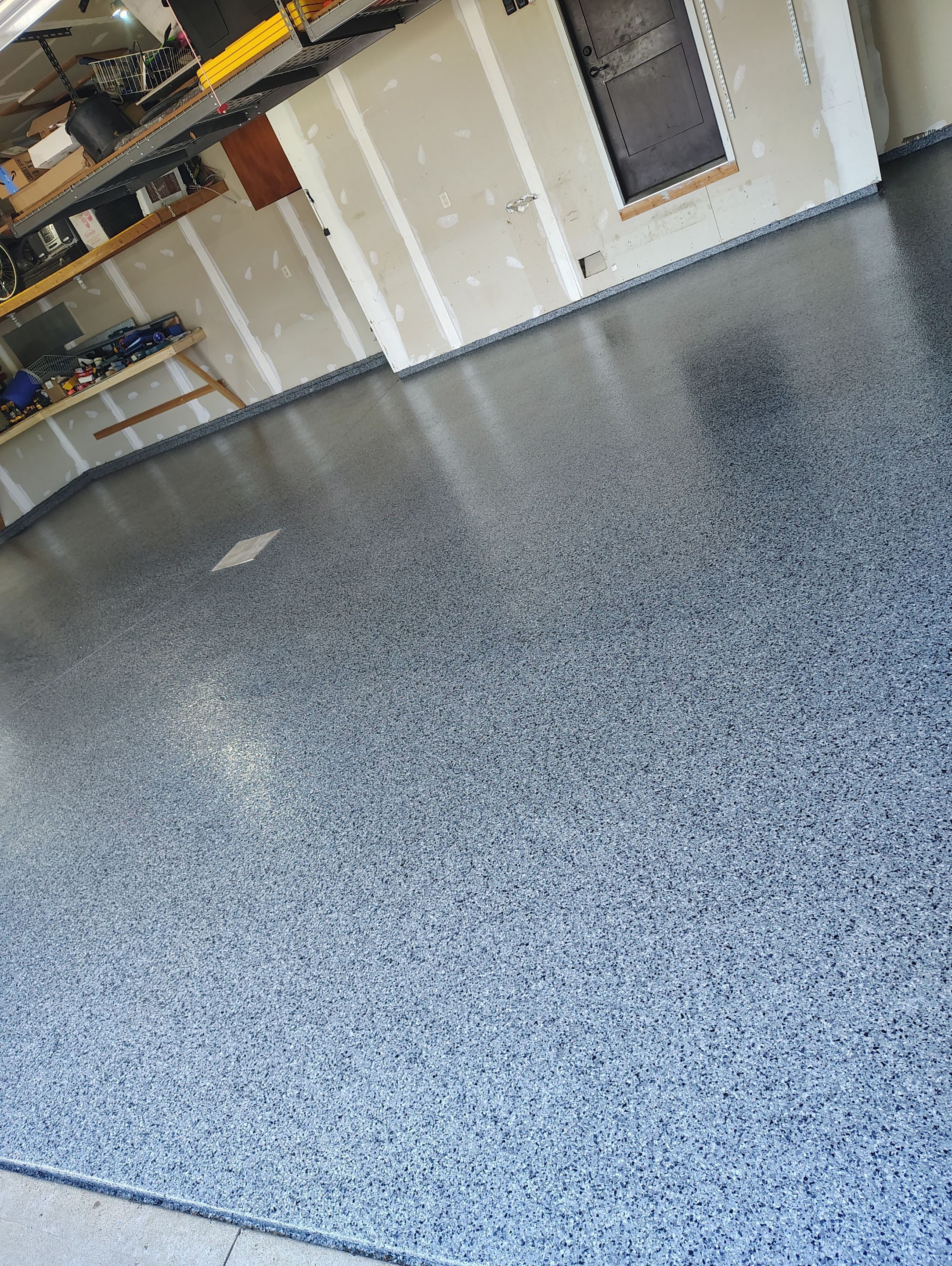 Sioux Falls Garage Concrete Grinding and Nightfall Decorative Chip Coating by Select Painting, Coatings & Garage Cabinets