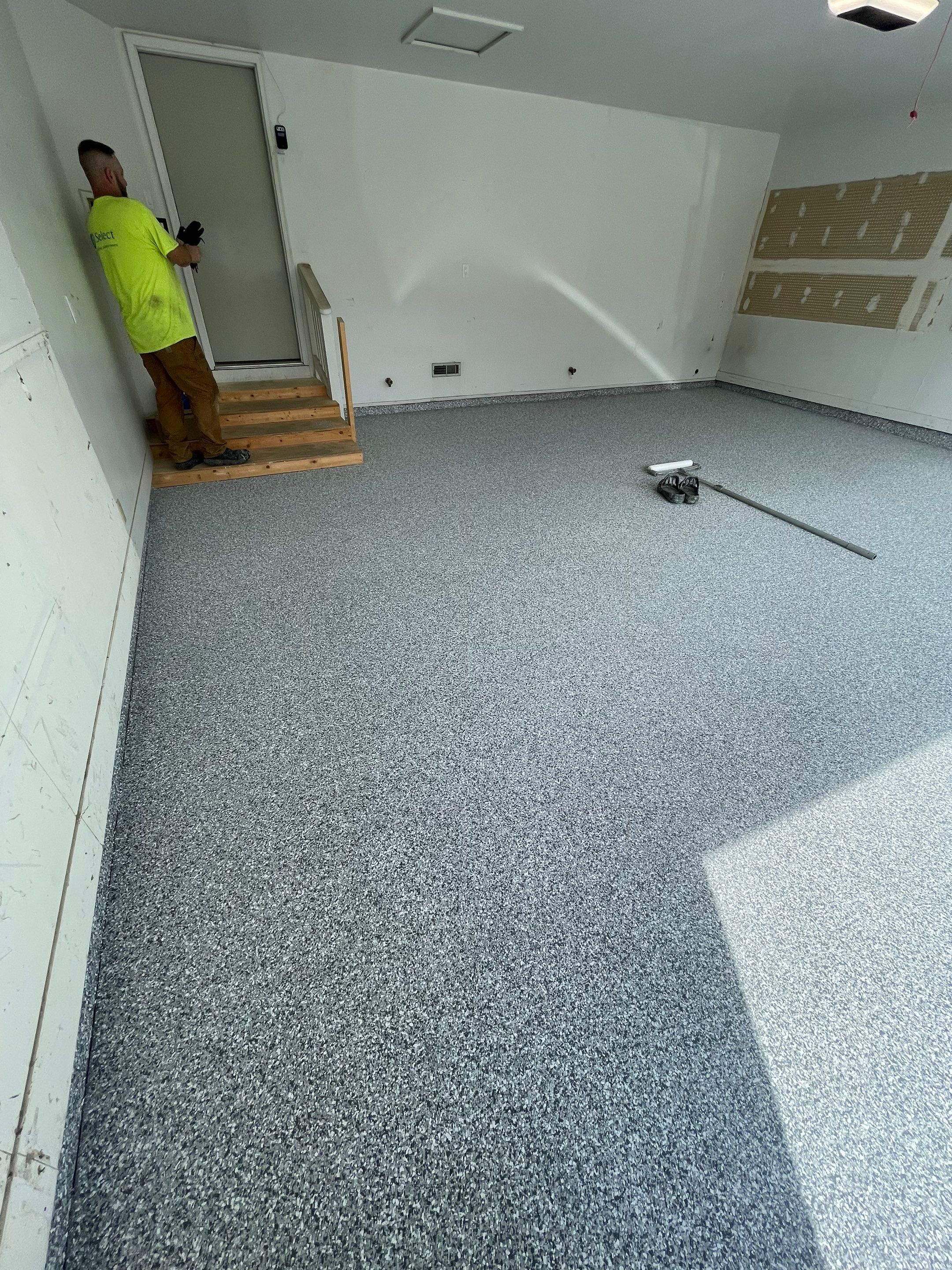 Grey Speckled Concrete Coating for Residential Garage in Yankton by Select Painting, Coatings & Garage Cabinets