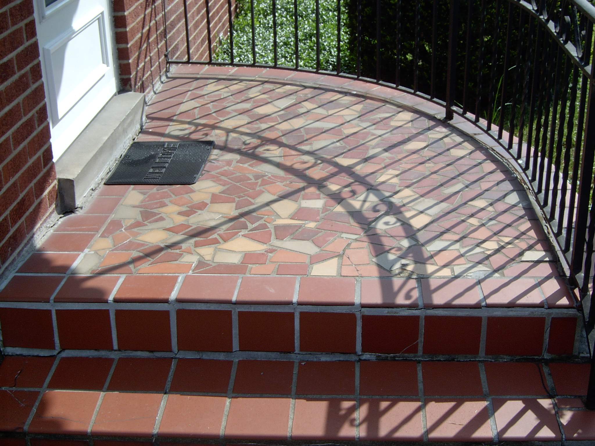 New front porch build, with tile floor and vinyl railing. by Secure Construction Company Inc