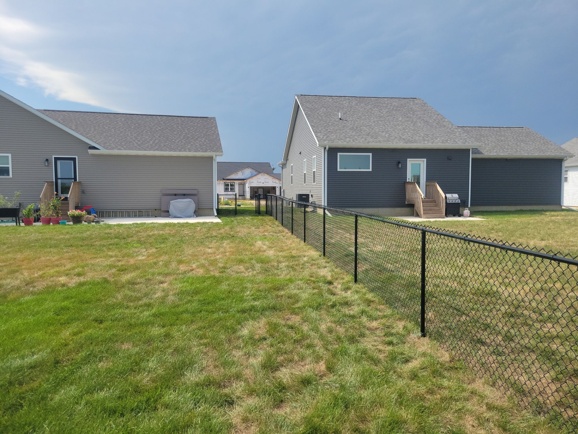 Residential Black Chain Link Fence Installation in Jesup by Perfect Picket Fence and Stain