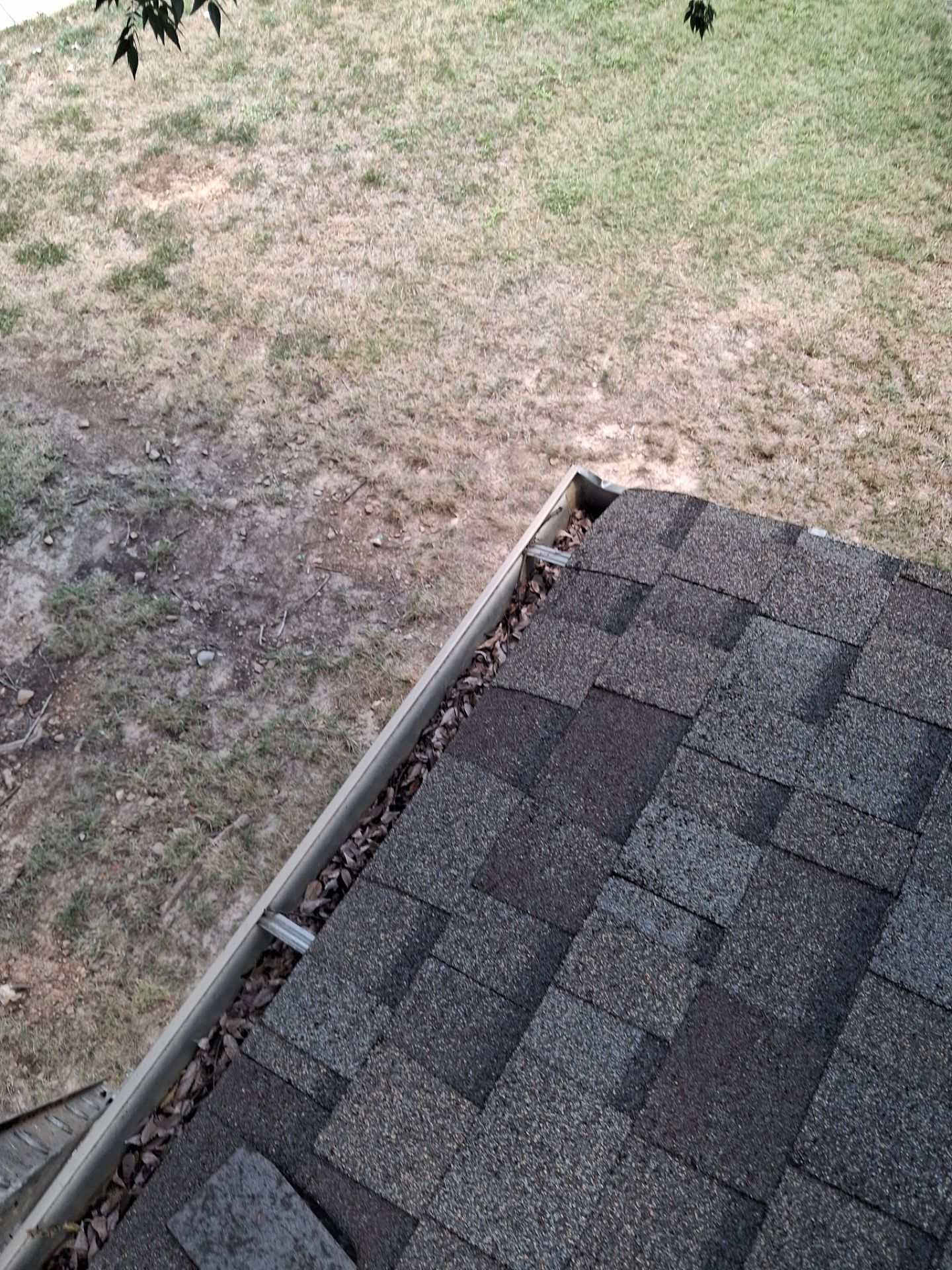 Commercial gutter cleaning Clarksville, TN before photo with filled gutters
