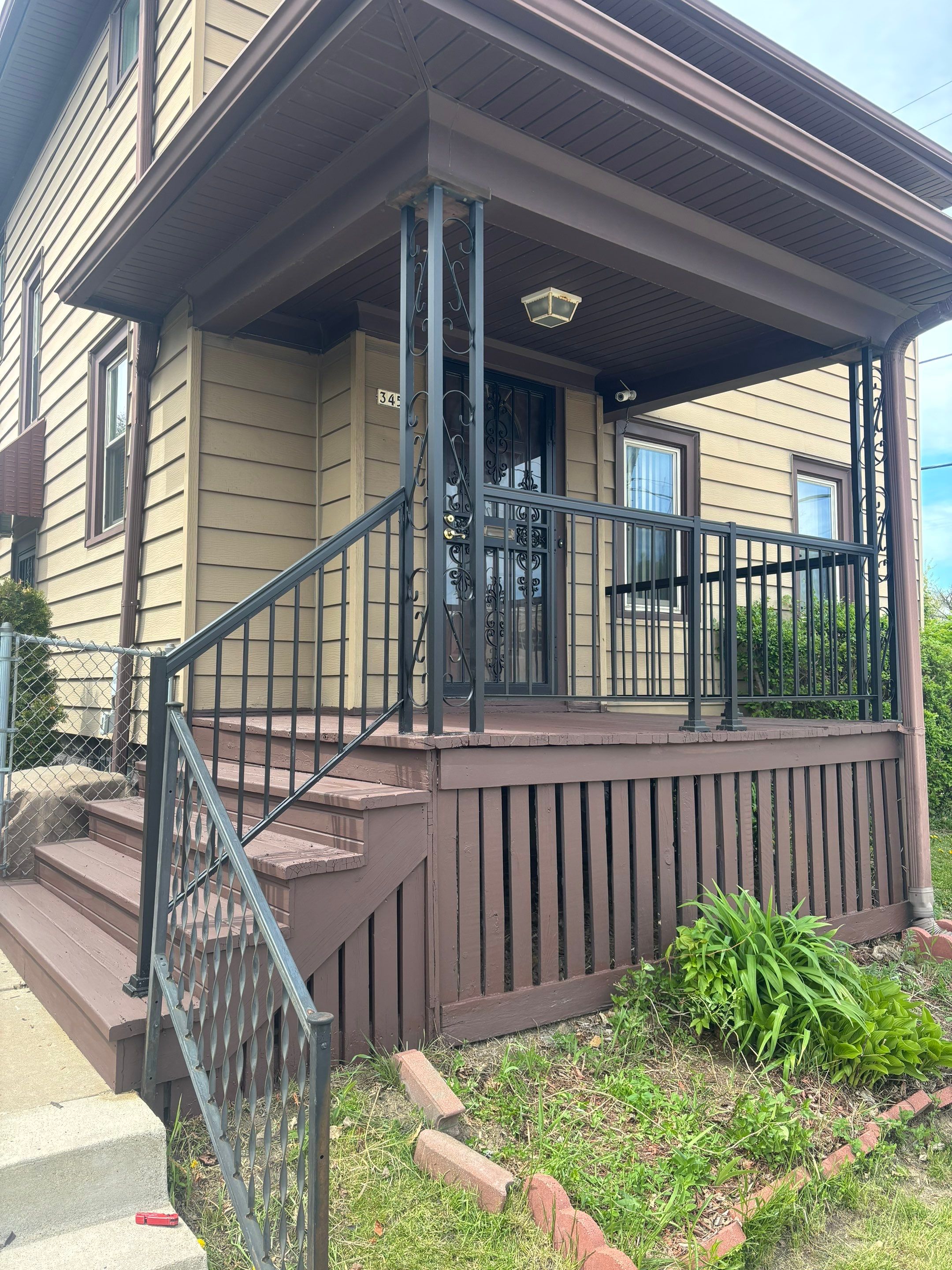 Milwaukee Exterior Porch Refinishing and Security Door Installation by OCS Contracting Services