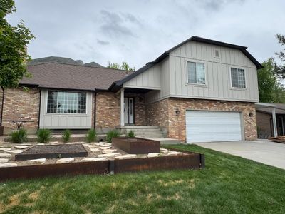 Cottonwood Heights | Custom Hardie Exterior & Bold Fascia | Cobble Stone Accents