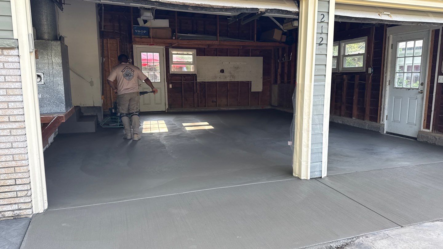 Concrete garage floor replacement  by NG Masonry & Construction LLC