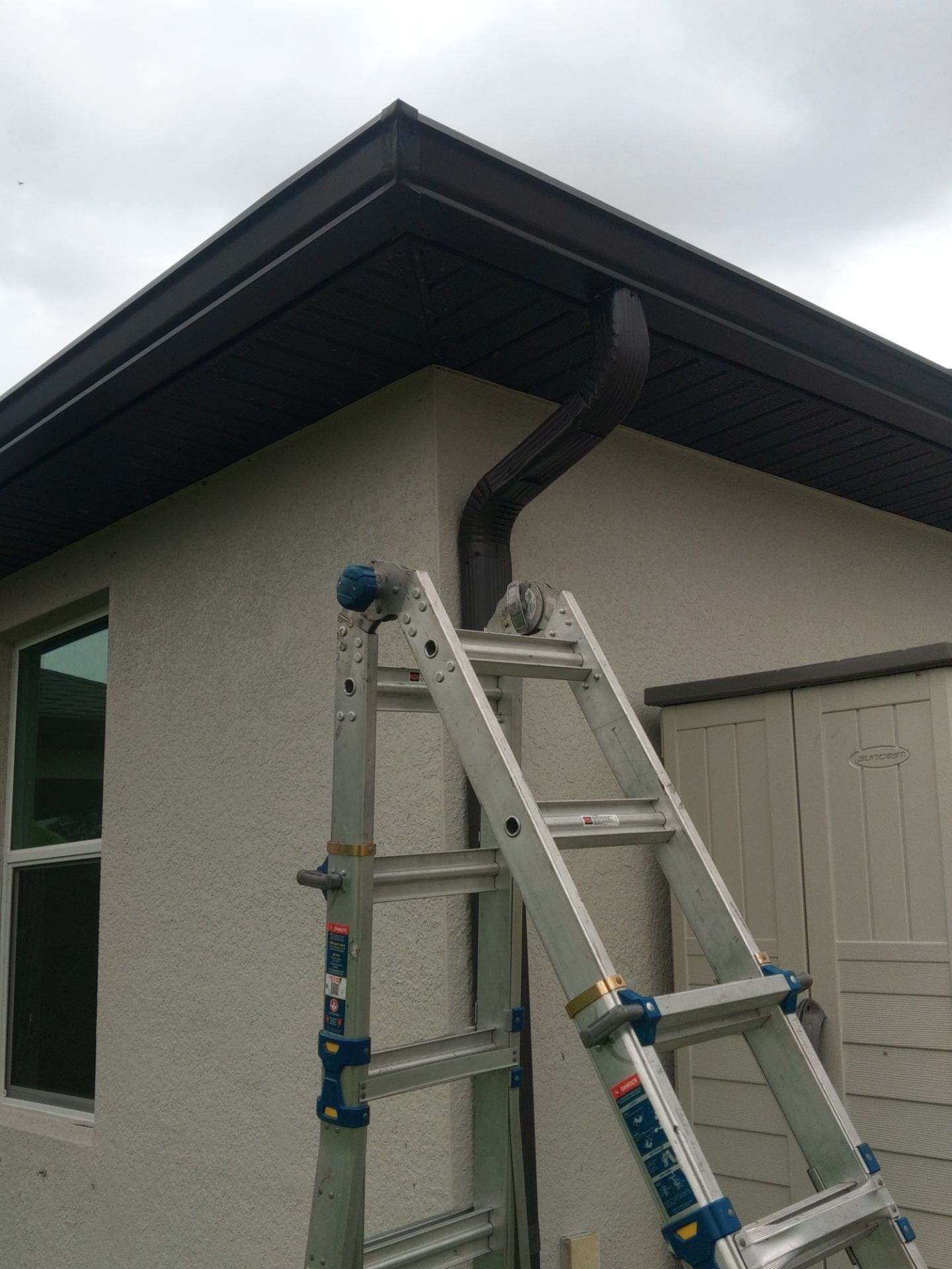 Black Seamless Gutters using black seamless gutters in Cape Coral FL by Gutter Professors