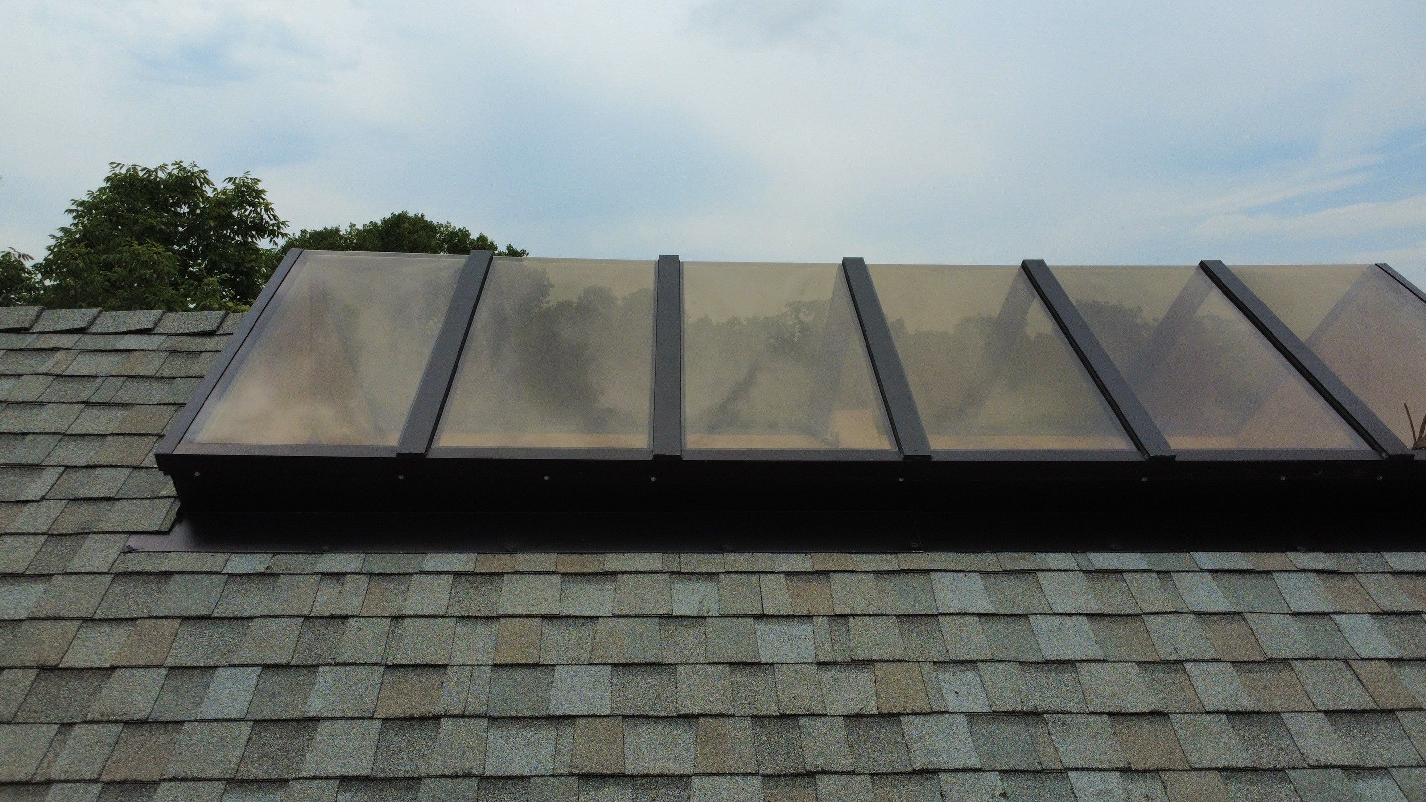 Asphalt Shingle and Skylight Replacement Project in Denver, CO by Blue Peaks Roofing LLC 