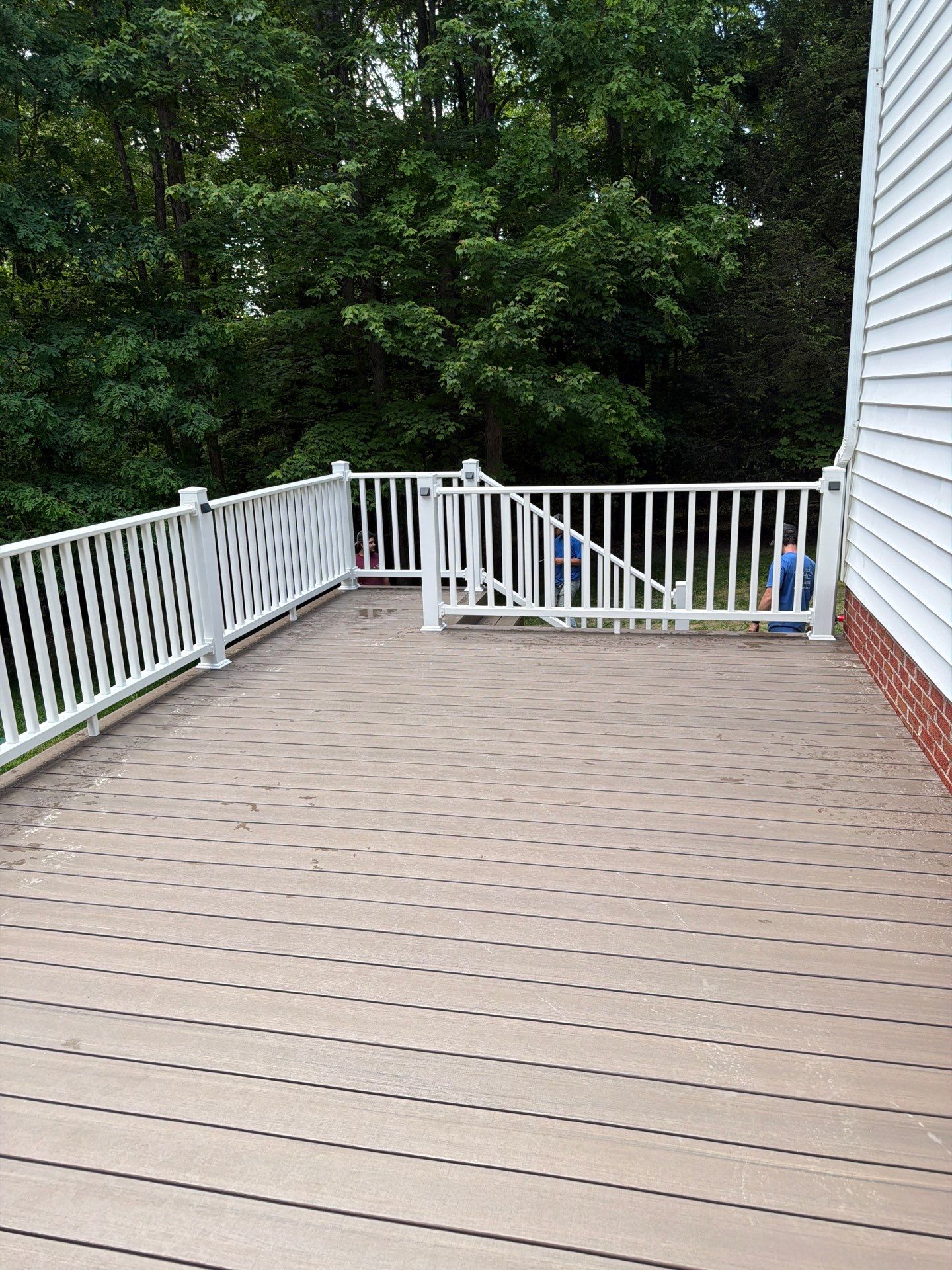 Custom Composite Deck and White Vinyl Railing Installation in Fayetteville by Walnut Hollow Decks & Outdoor Living