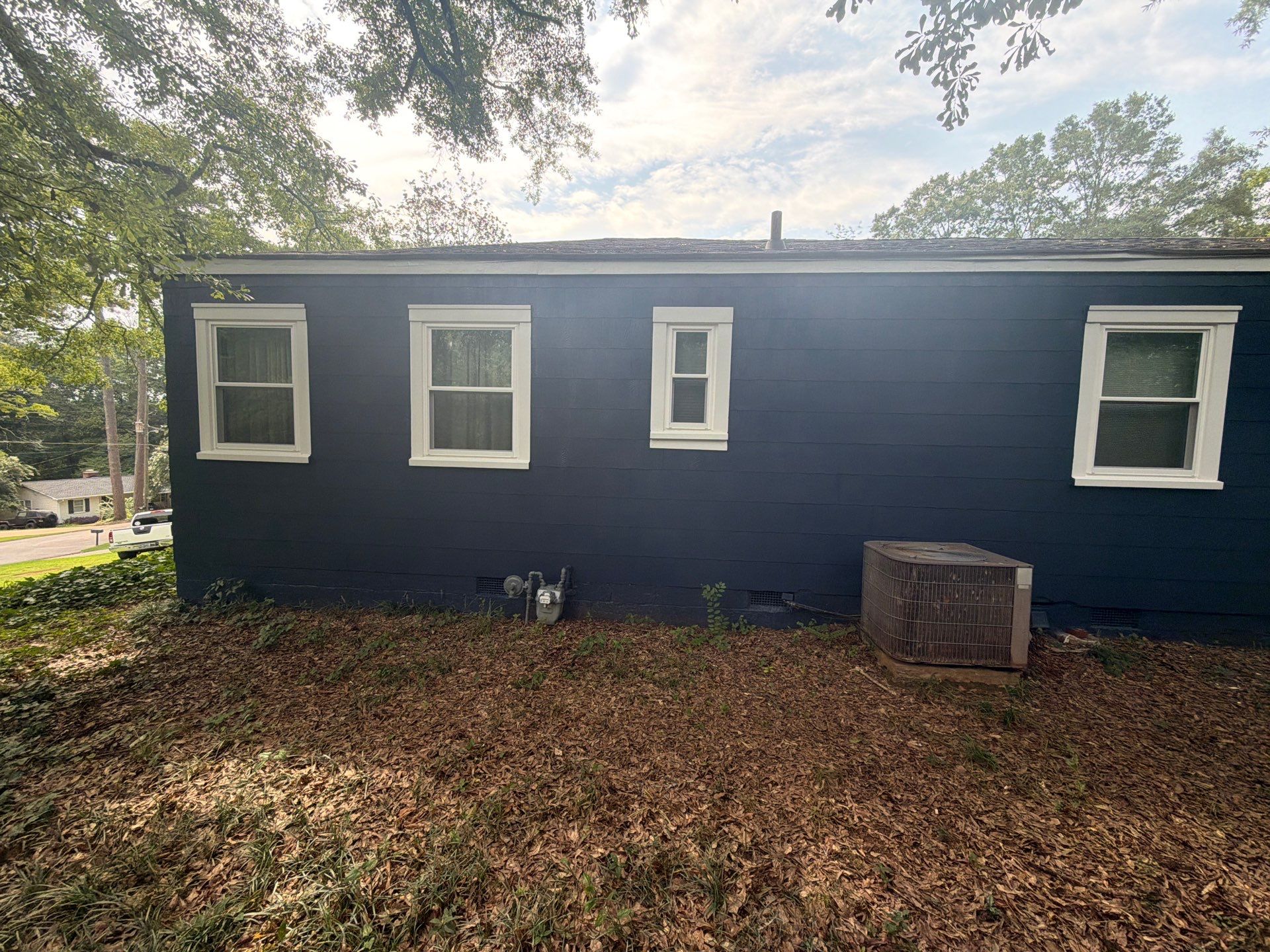 Full Exterior Repaint with Navy Blue and White Trim by Swift Home Renovations