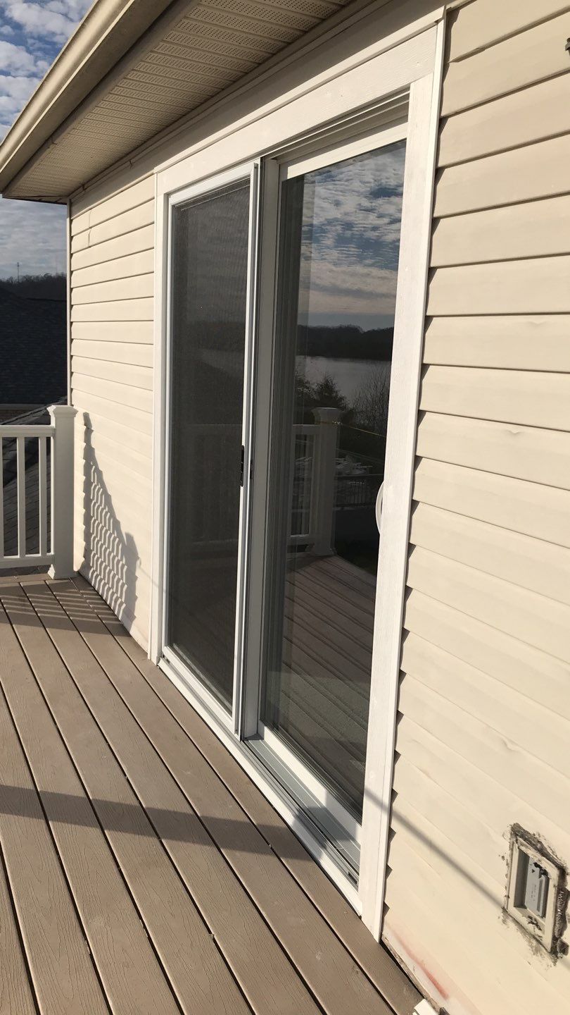 Deck Refurbush and Door Replacement using Trex Decking and Railing. Polaris Patio Doors by Secure Construction Company Inc