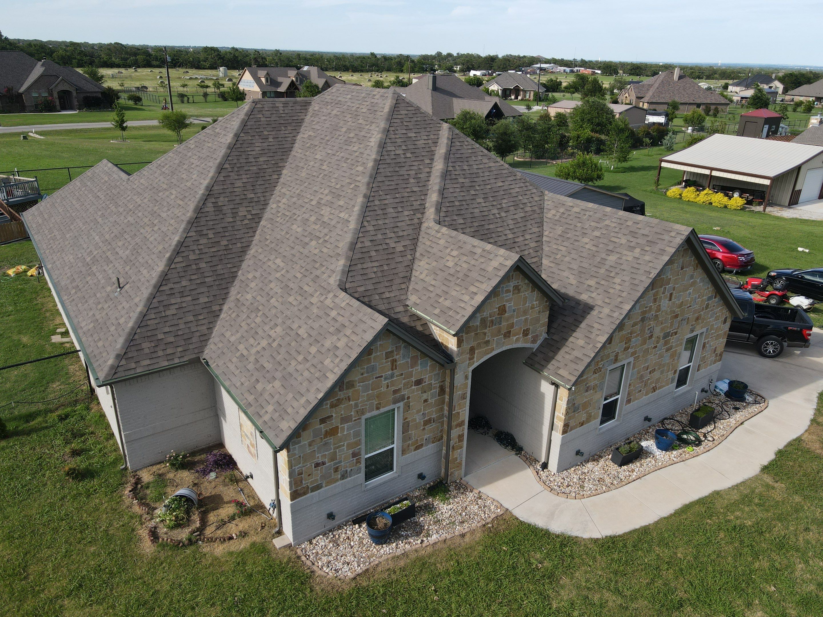 Architectural Shingle Roof Installation and Gutter Updates in Springtown by Berry Good Roofing