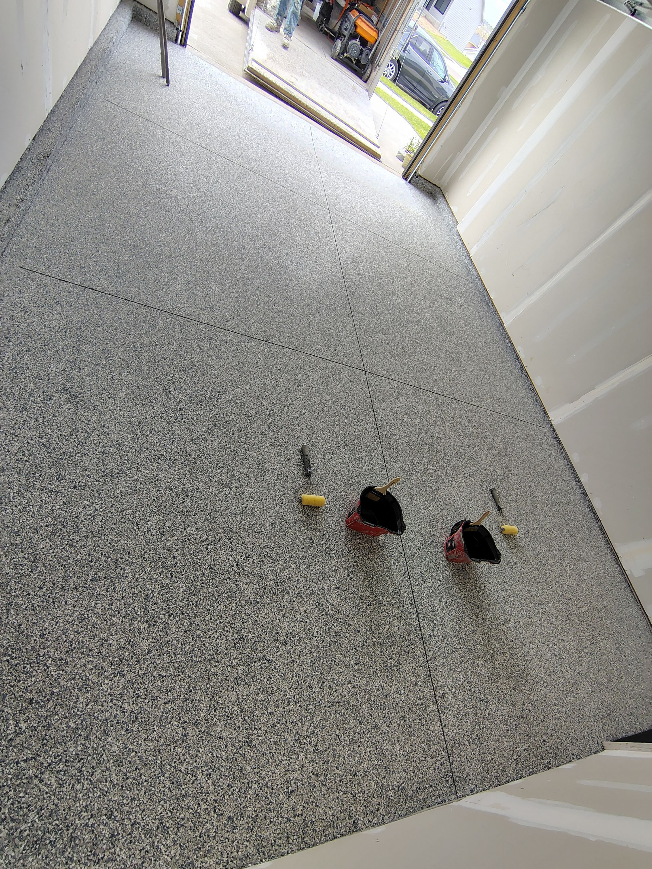 Custom Epoxy Garage Floor Coating Installation in Sioux Falls by Select Painting, Coatings & Garage Cabinets