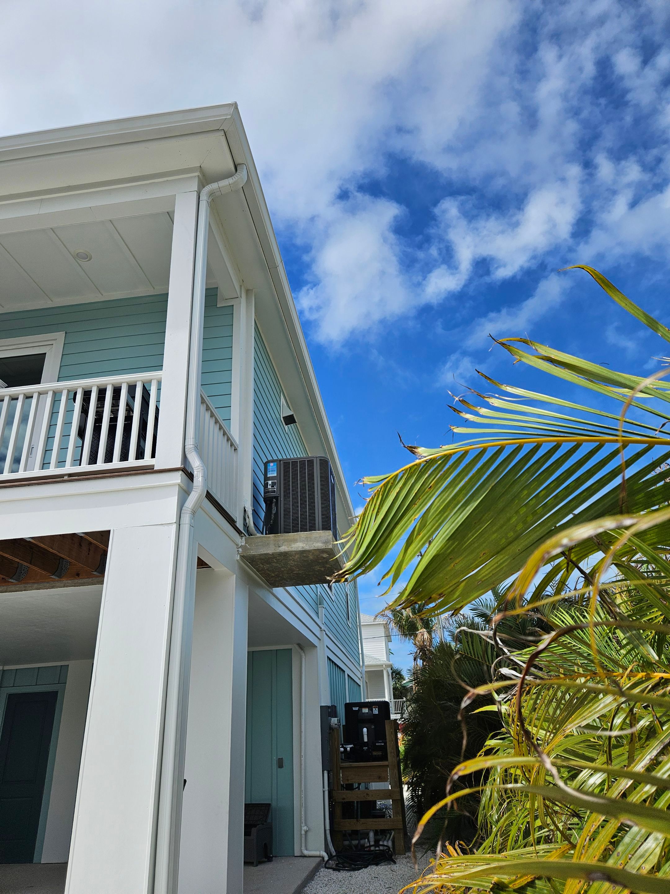 New White Seamless Gutters Installation and Downspouts, Reseal Gutters in Fort Myers Beach, FL  by Gutter Professors