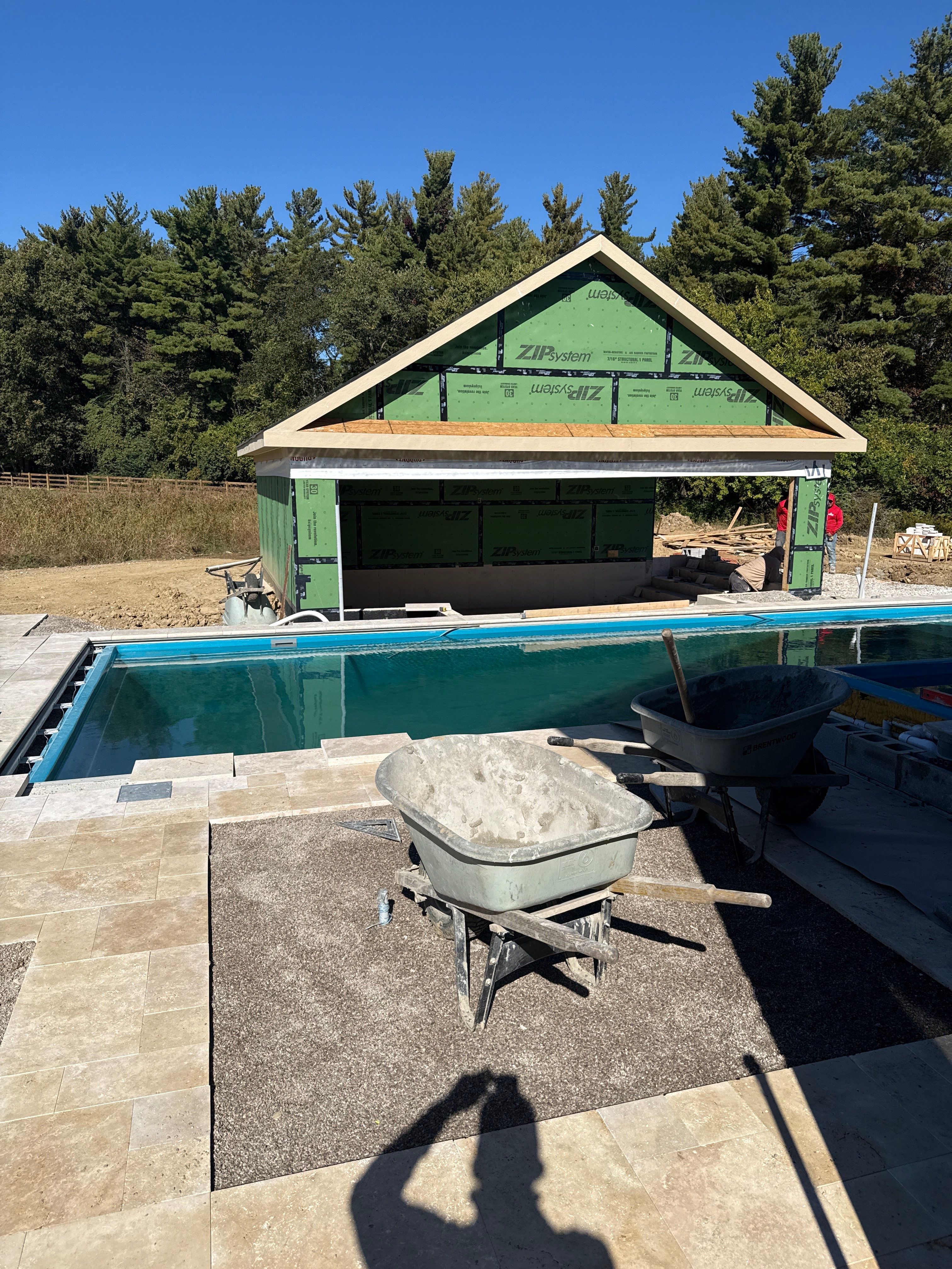 Custom Travertine Pool Deck with Artificial Turf Insets in Delaware by Southwest Greens Midwest