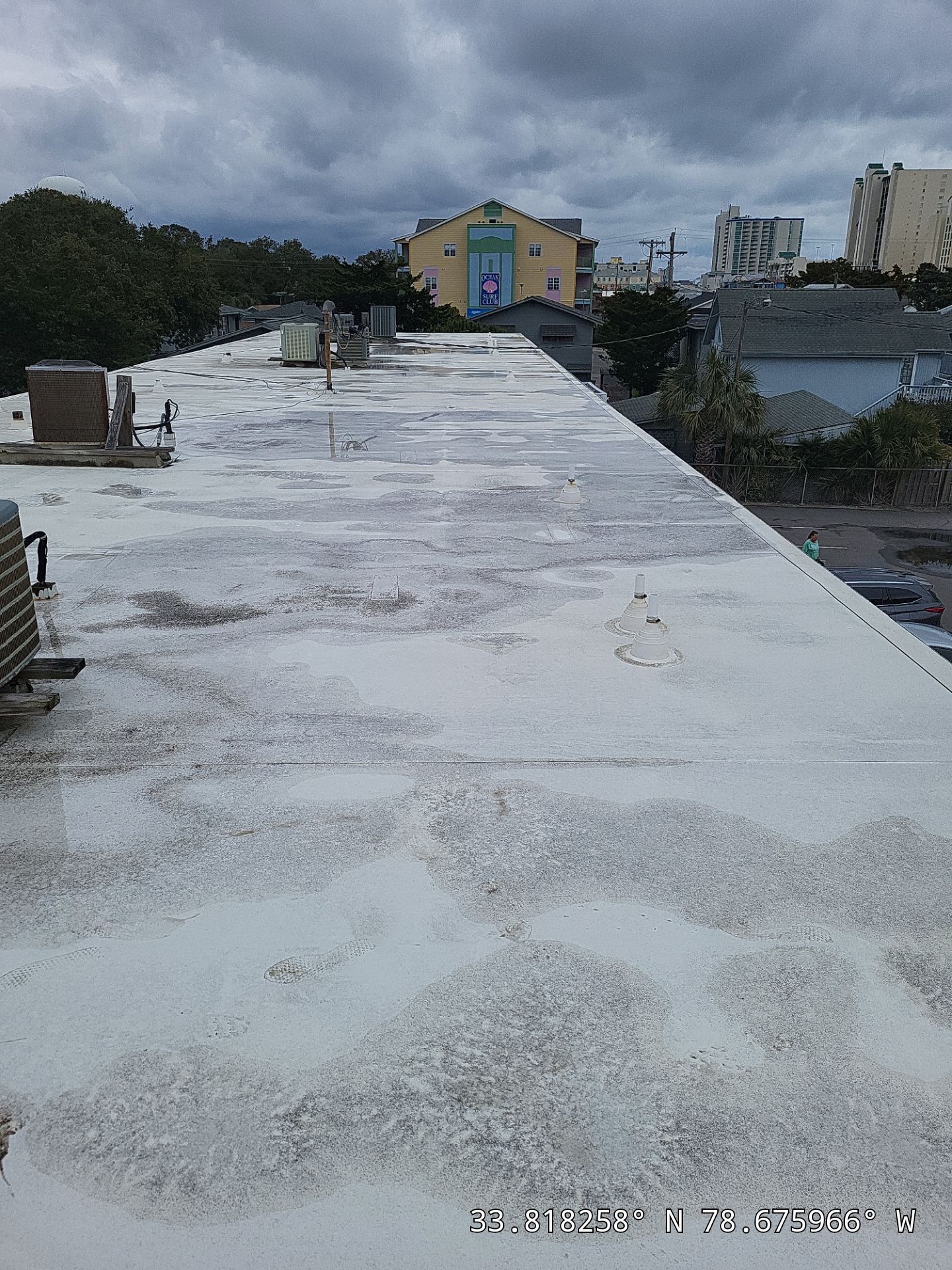 Commercial Building Roof Coating using 924 Eterna-Sil Premium Silicone Roof Coating by RGR Construction and Roofing, LLC