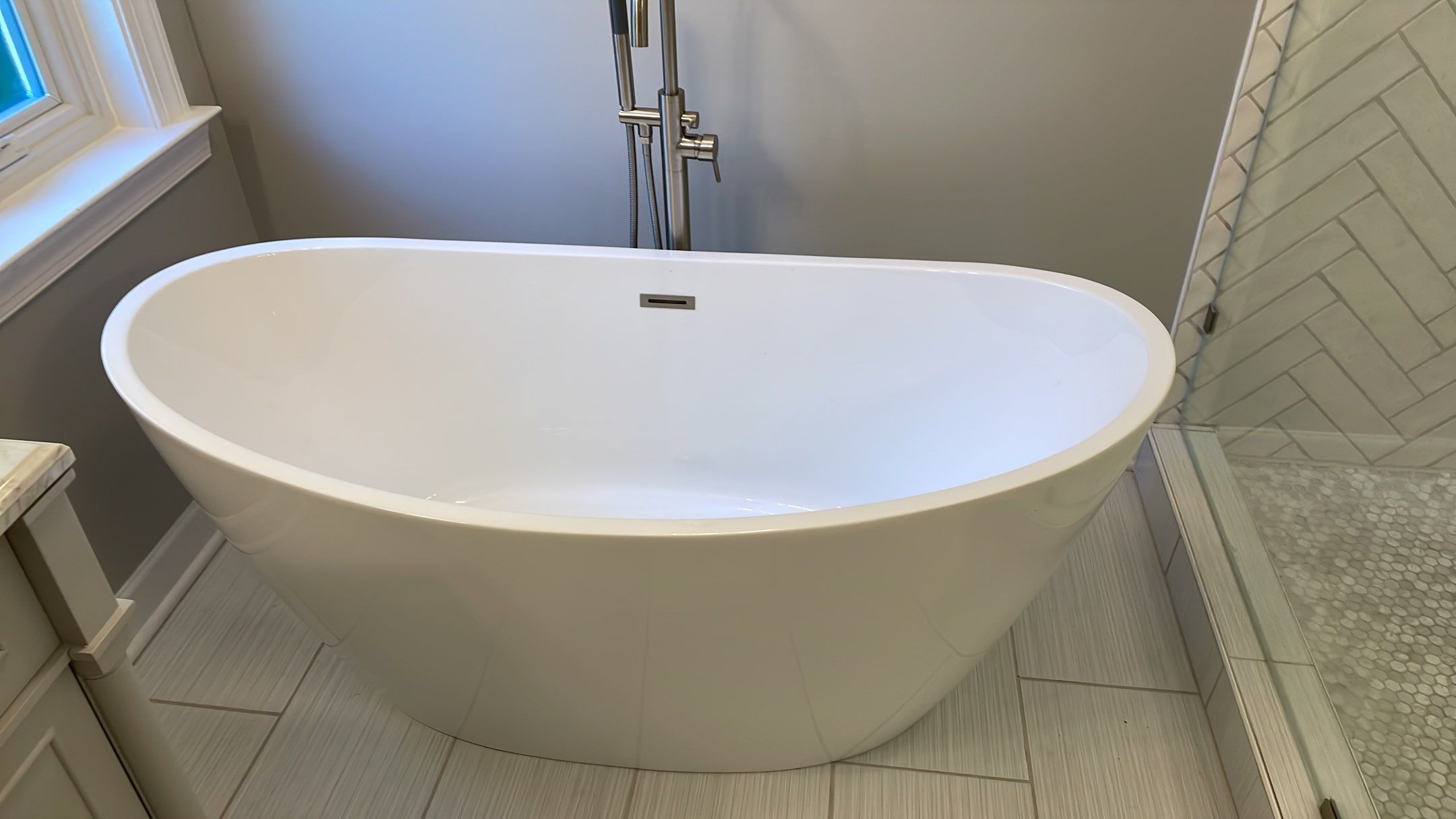 Bathroom Remodel using Schluter by Footprints Floors of Coastal Carolina