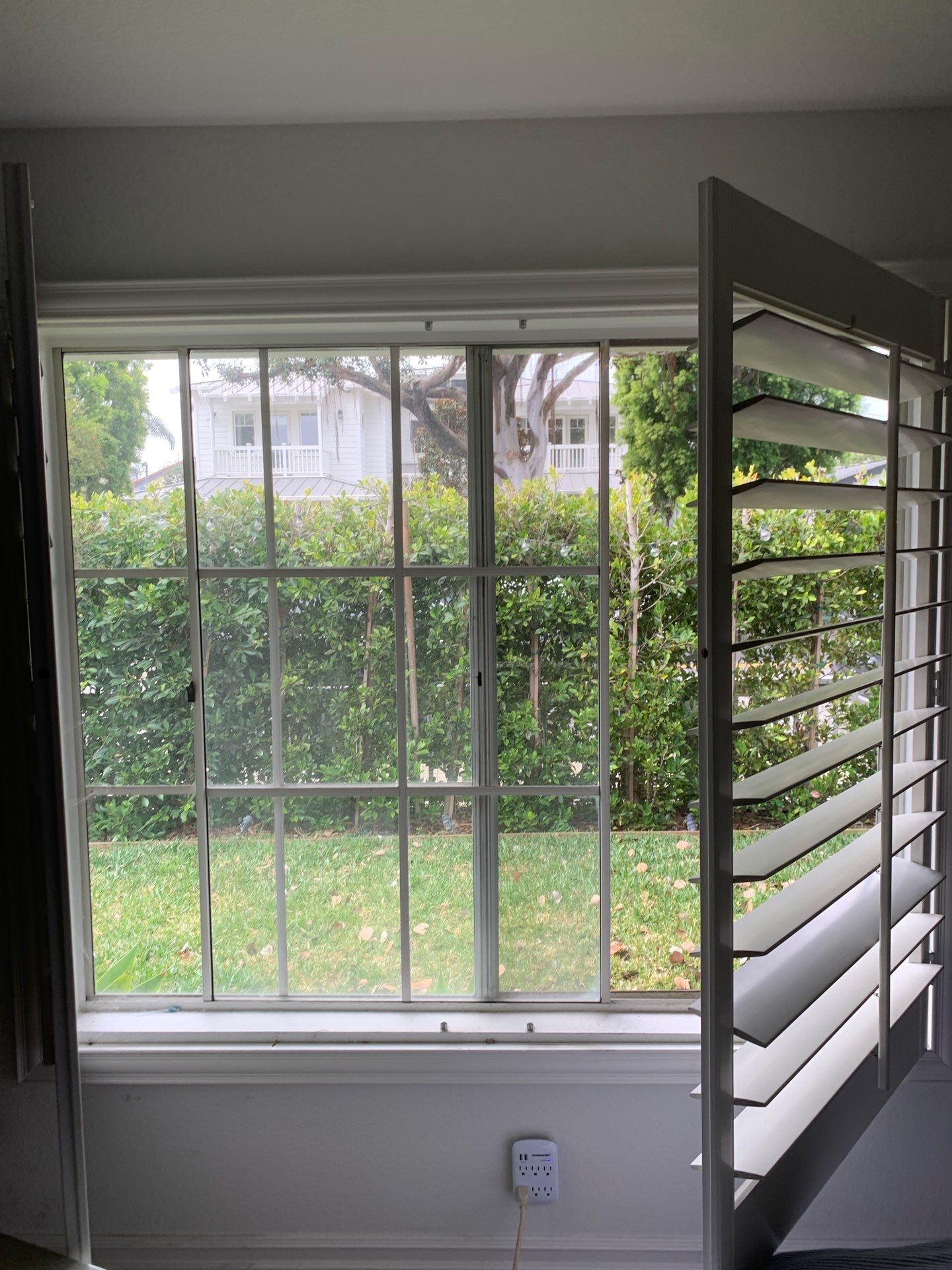 Window Installation using Milgard black vinyl windows by American Window Company