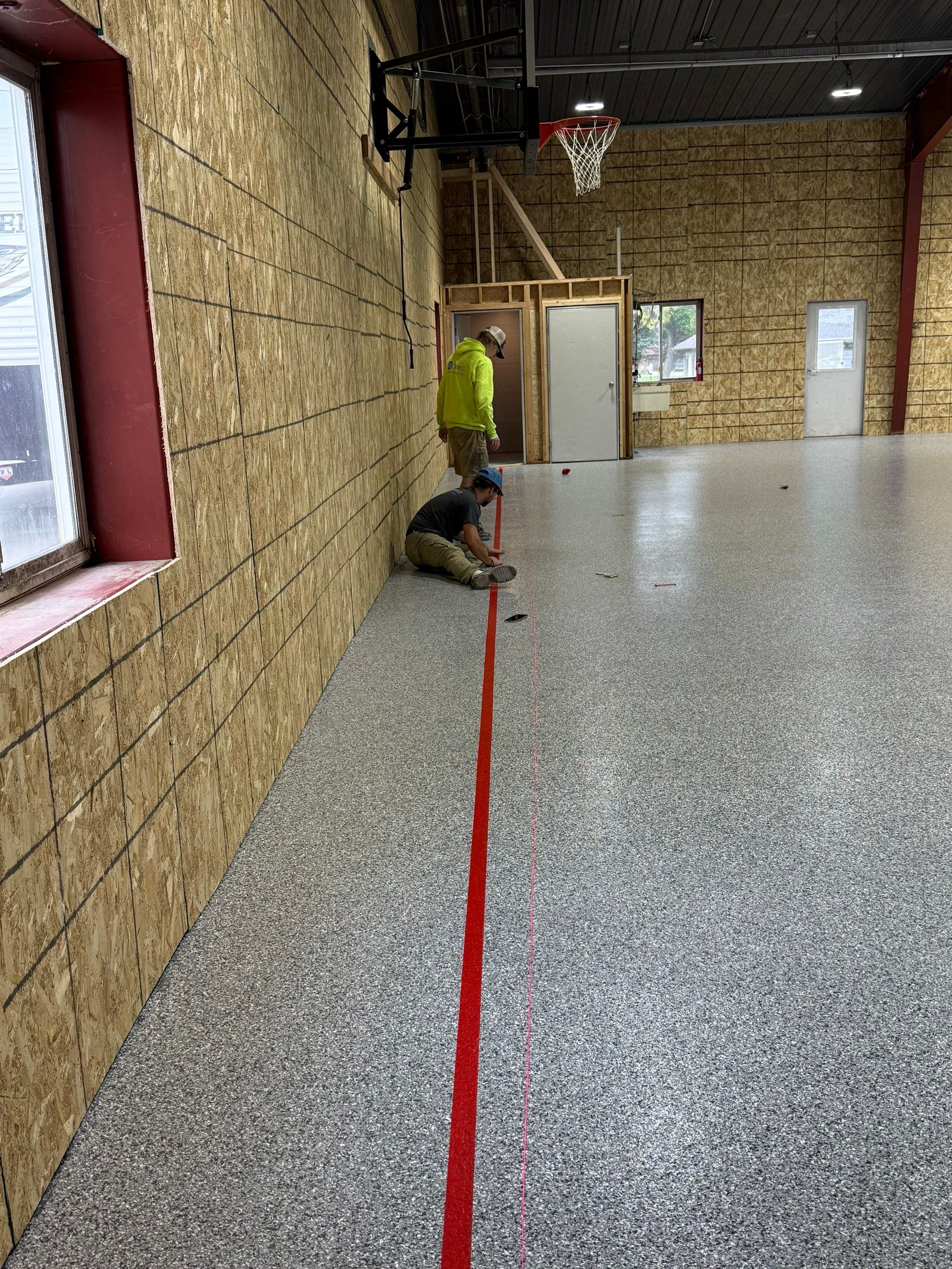 Custom Polyurea Shop Floor with Basketball Court Lines in Rock Valley by Select Painting, Coatings & Garage Cabinets
