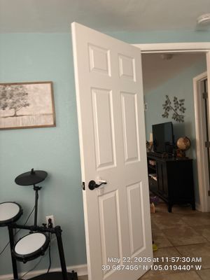 Interior Renovation Featuring New Paneled Doors and Tile Flooring