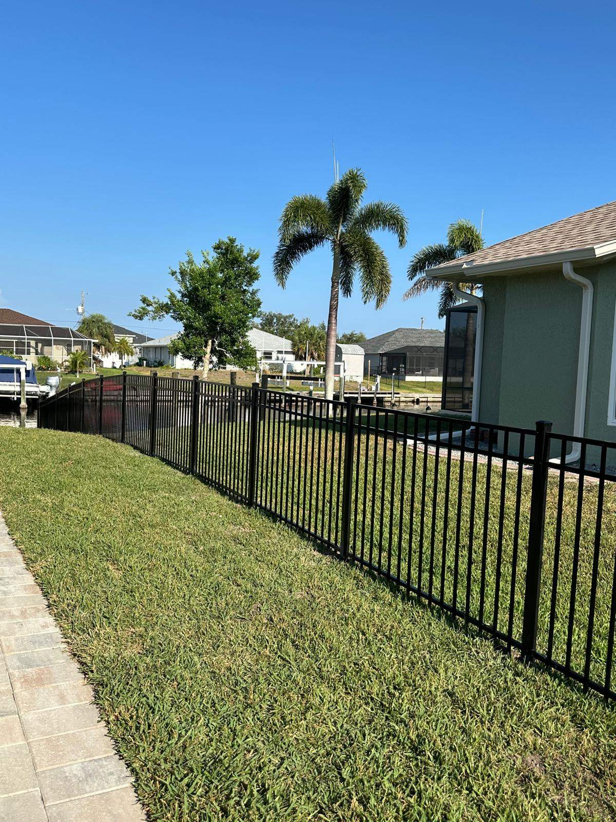 Waterfront Black Aluminum Fence Installation in Port Charlotte by True Fence LLC