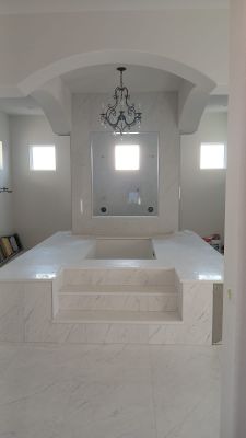 Kitchen and Bathroom Remodel Featuring Custom Stone and Tile in Mico