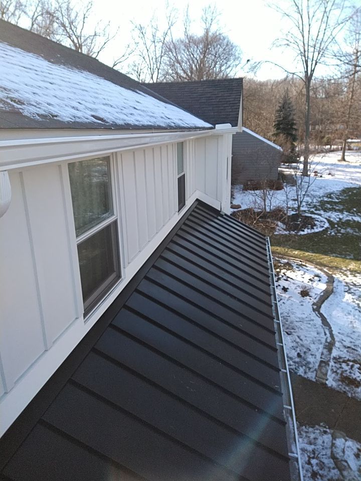 James Hardie Siding  using James Hardie Board and Batten, White by Absolute Roofing and Construction