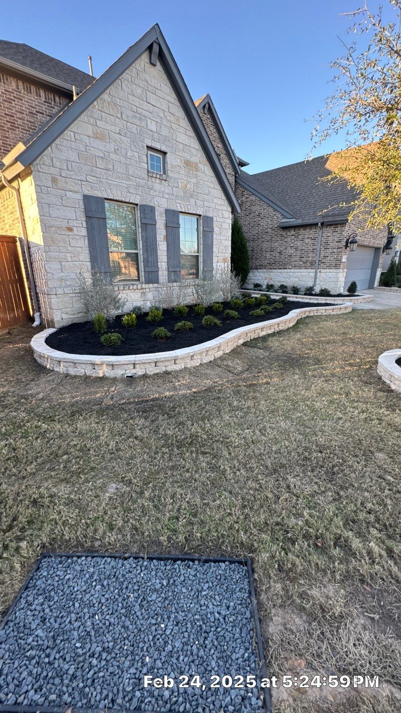 🌿✨ Darlene & Andrew’s Amazing Curb Appeal Transformation  Some projects are more than just landscaping—they’re a conversion of curb appeal from the ground up. For Darlene & Andrew, Alejandro and the Texas Urban Team designed and delivered a complete solution that reshaped their flower beds, solved drainage challenges, and gave new life to the sideyard.  💡 From planning to execution, every step was tailored to build both beauty and functionality:  🌸 Flower Beds, Reinvented  Demolition of old beds, plants, and mulch.  Fresh soil preparation, weed protection, and a brand-new retainer wall built with hand-cut stone and decorative caps.  Carefully selected plants and garden mix to ensure health and visual harmony.  💧 Drainage & Irrigation Upgrades  Outdated corrugated pipes replaced with PVC drainage lines to carry water safely away from the foundation.  New irrigation system combining drip lines and sprinklers—watering plants while keeping the house walls protected.  Sideyard drainage extended with catch basins and PVC piping to prevent water pooling and foundation stress.  🚶 Functional Sideyard with Walkway & Trash Area  Graded and leveled sideyard to manage runoff.  Installed a modern gravel and paver walkway for easy access.  Built a firm and tidy concrete-paver pad for trash containers—making the space both practical and polished.  🛠️ Stonework & Craftsmanship  Every stone in the retainer wall was cut, set, and secured by the team of handcrafters, ensuring a durable build that doubles as a design statement.  ✅ Outcome: Darlene & Andrew’s property now has better drainage, a clean and organized sideyard, and elegant new flower beds—all designed for long-term durability and lasting beauty.  📢 Before hiring anyone, review our portfolio. Our work speaks louder than words—each project is a blend of function, protection, and design crafted to last. by Texas Urban Elements