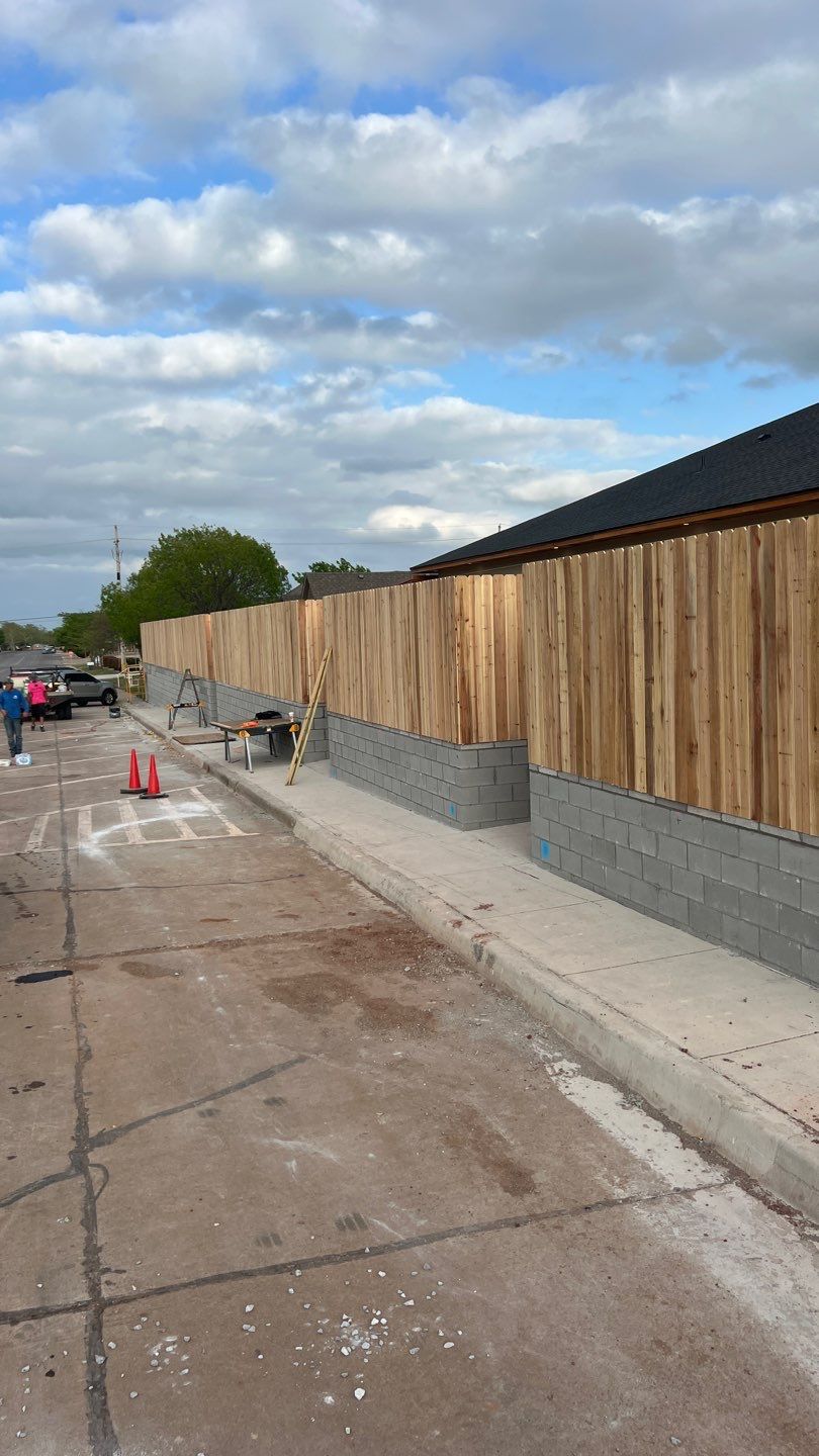 Cedar Fence using Cedar Pickets and Metal Poles by Clays Services Inc