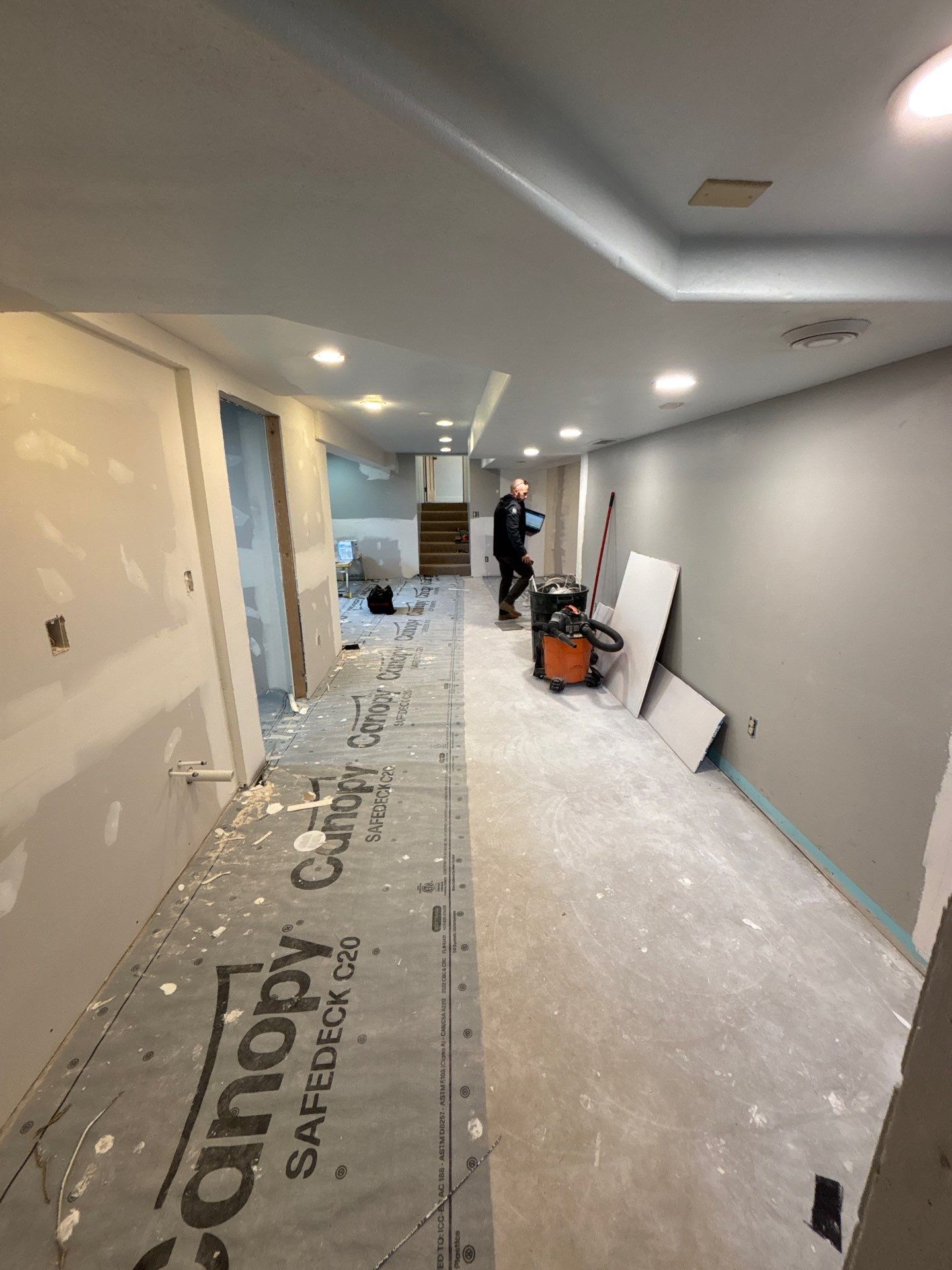 High-Gloss Epoxy Floor Coating and Basement Renovation in Rock Rapids by Select Painting, Coatings & Garage Cabinets
