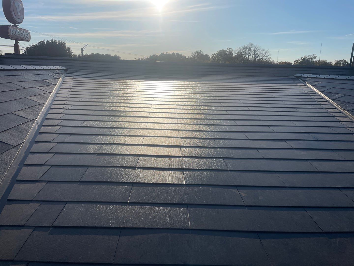 Tesla Solar Roof on a Commercial Building by American Home Contractors