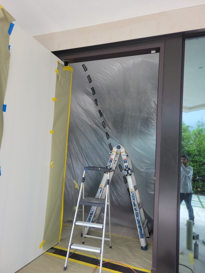 Custom Material Pivot Door installation by Impact Precious Wood Inc.