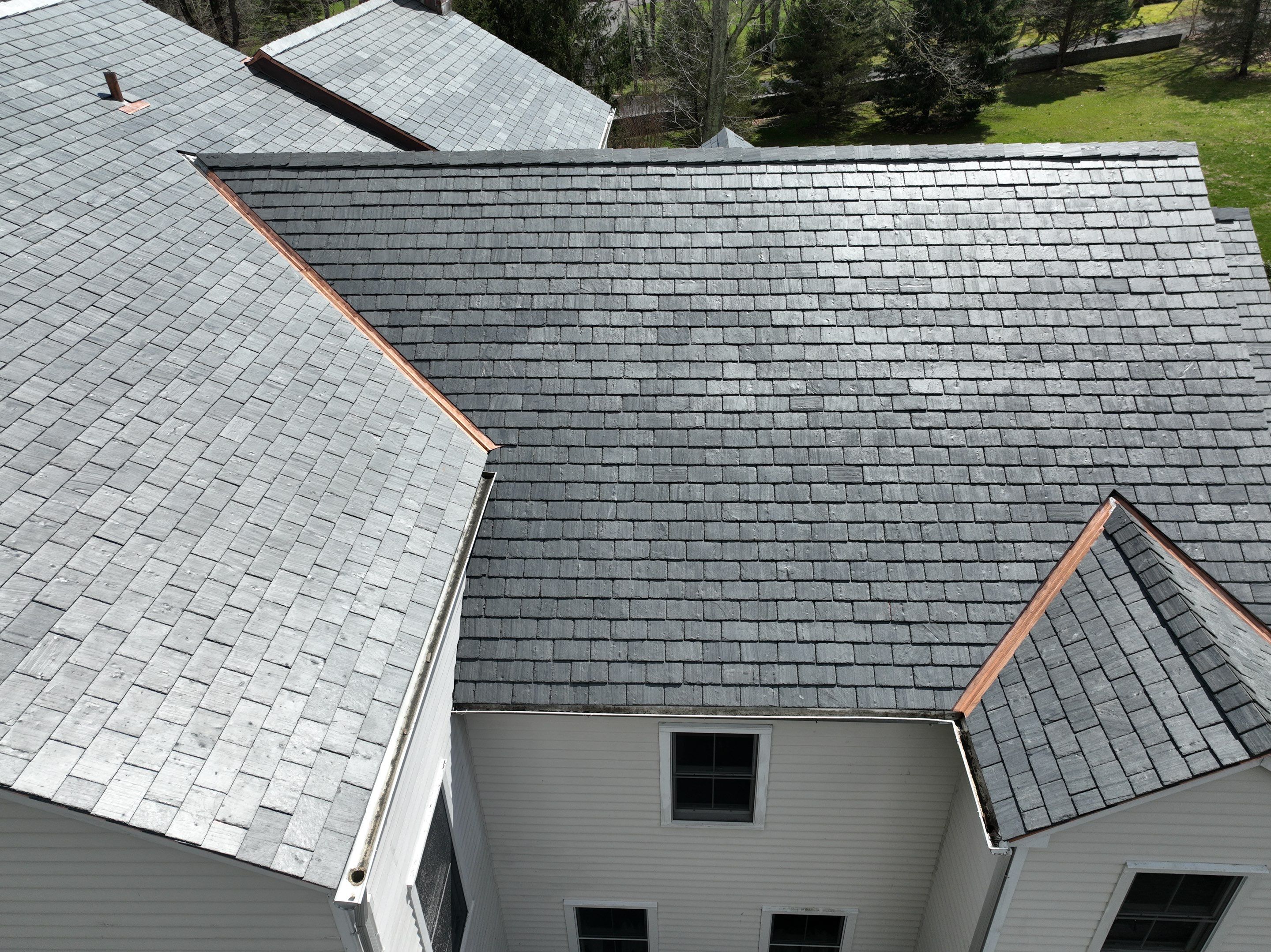Residential Roofing Installation using Vermont Slate by A Plus Exterior