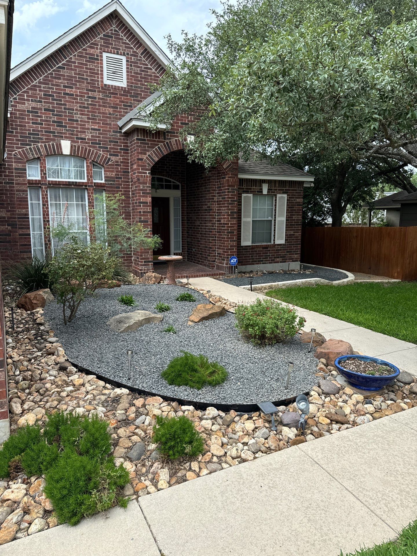 Landscaping Enhancement using Texas Black Gravel by Hole In One Lawns, LLC