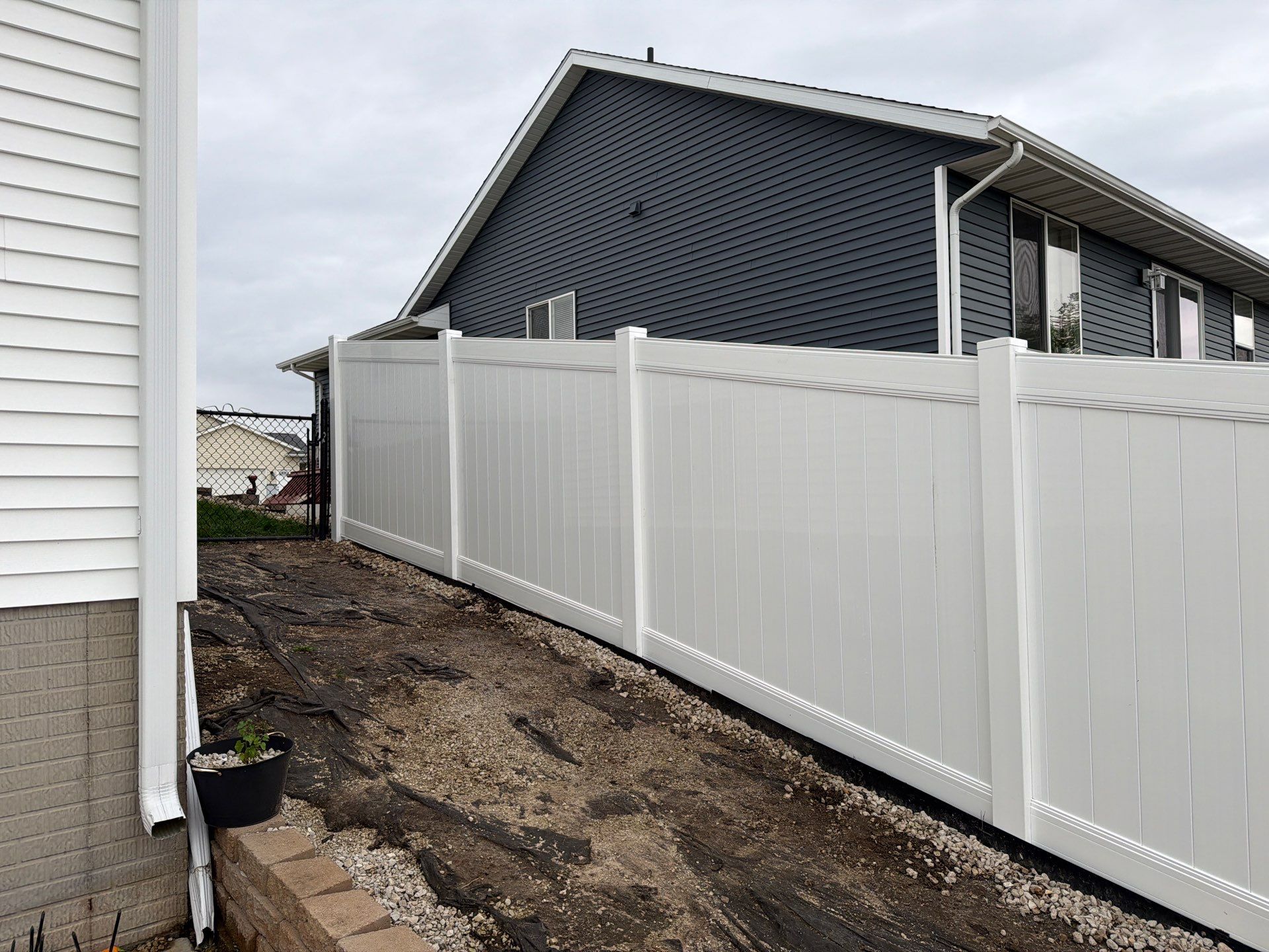 Residential Vinyl Privacy Fence Installation in Urbana by Perfect Picket Fence and Stain