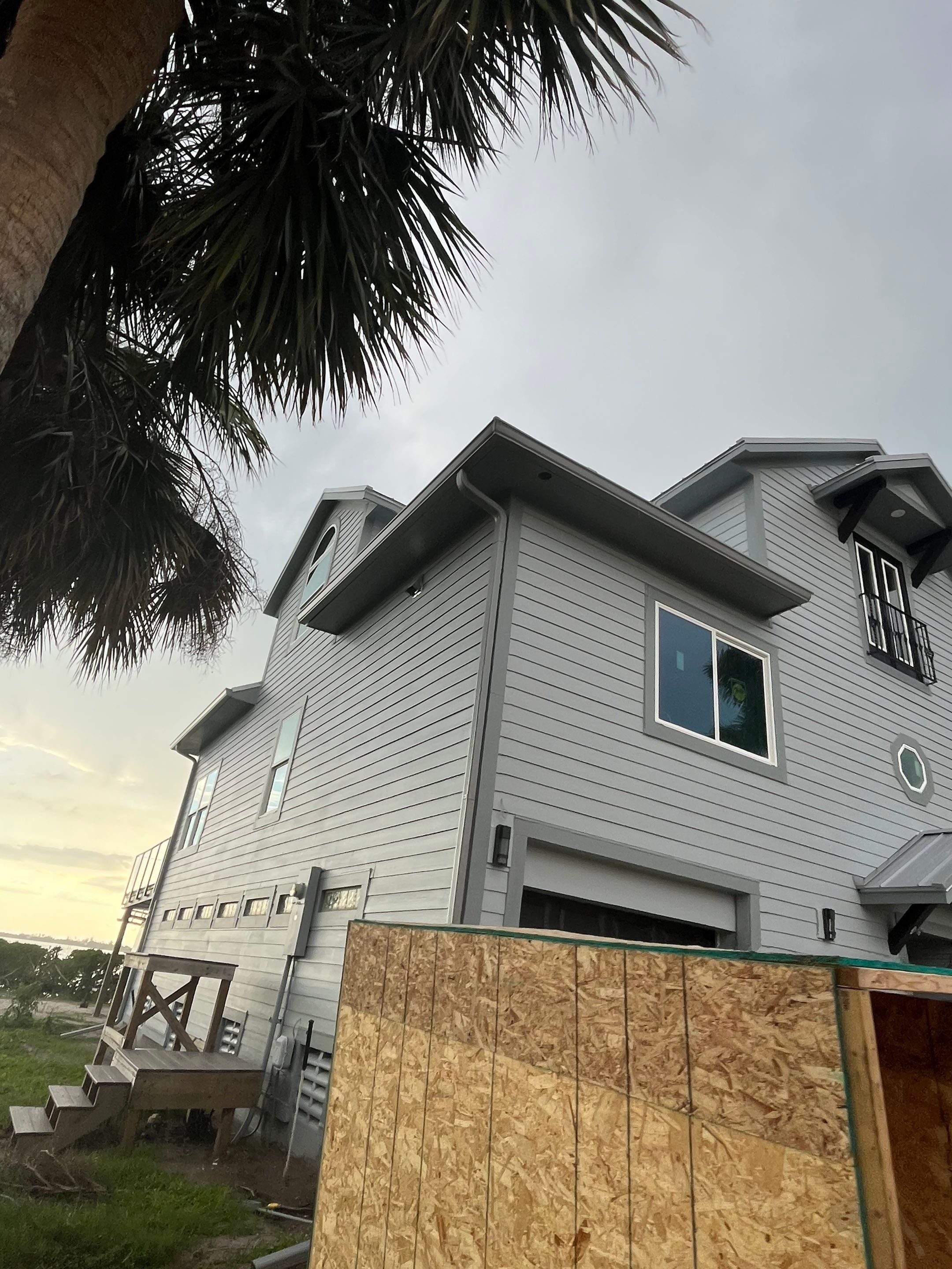 Downspout Installation Dove Grey Palmetto FL by Gutter Professors