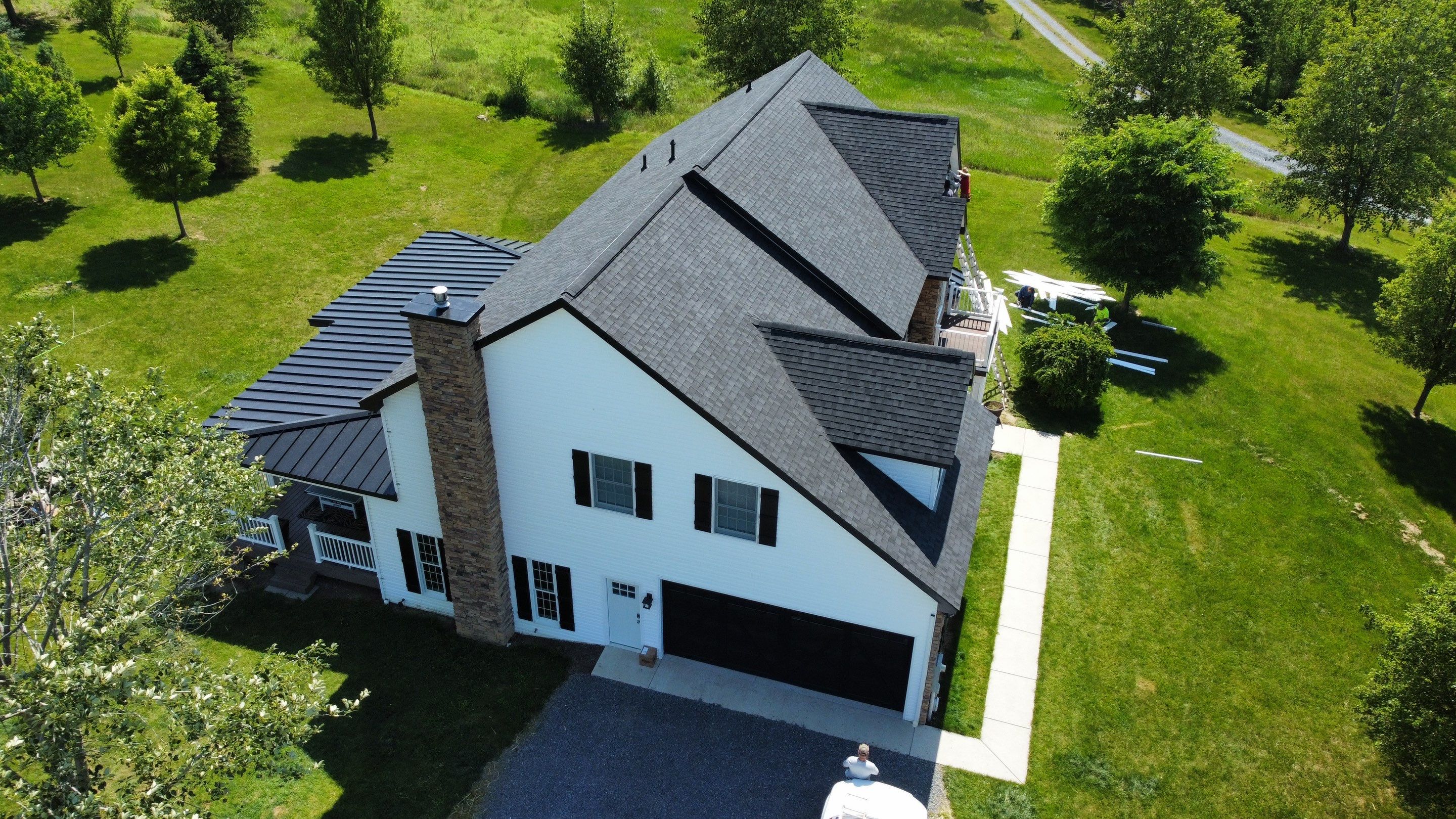 Roof Damage using Certainteed Lifetime Roofing System- Moire Black Landmark Pro shingkes with shadow ridge caps. by BulletpROOF Exteriors