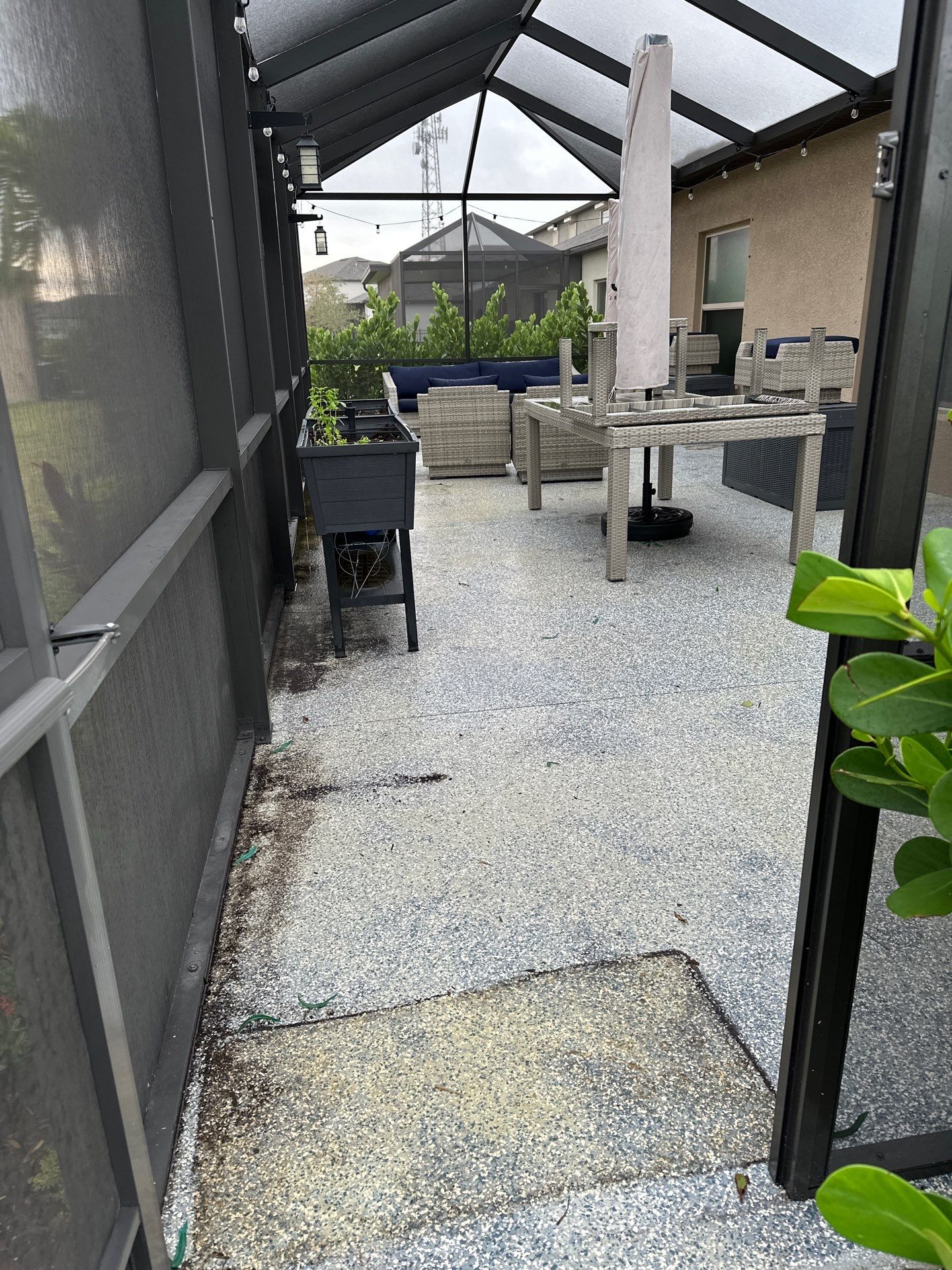 Lanai & Patio Cleaning with Epoxy-Coated Concrete Floor in Trevesta Community, Palmetto, FL | Sunshine AquaWash by Sunshine AquaWash