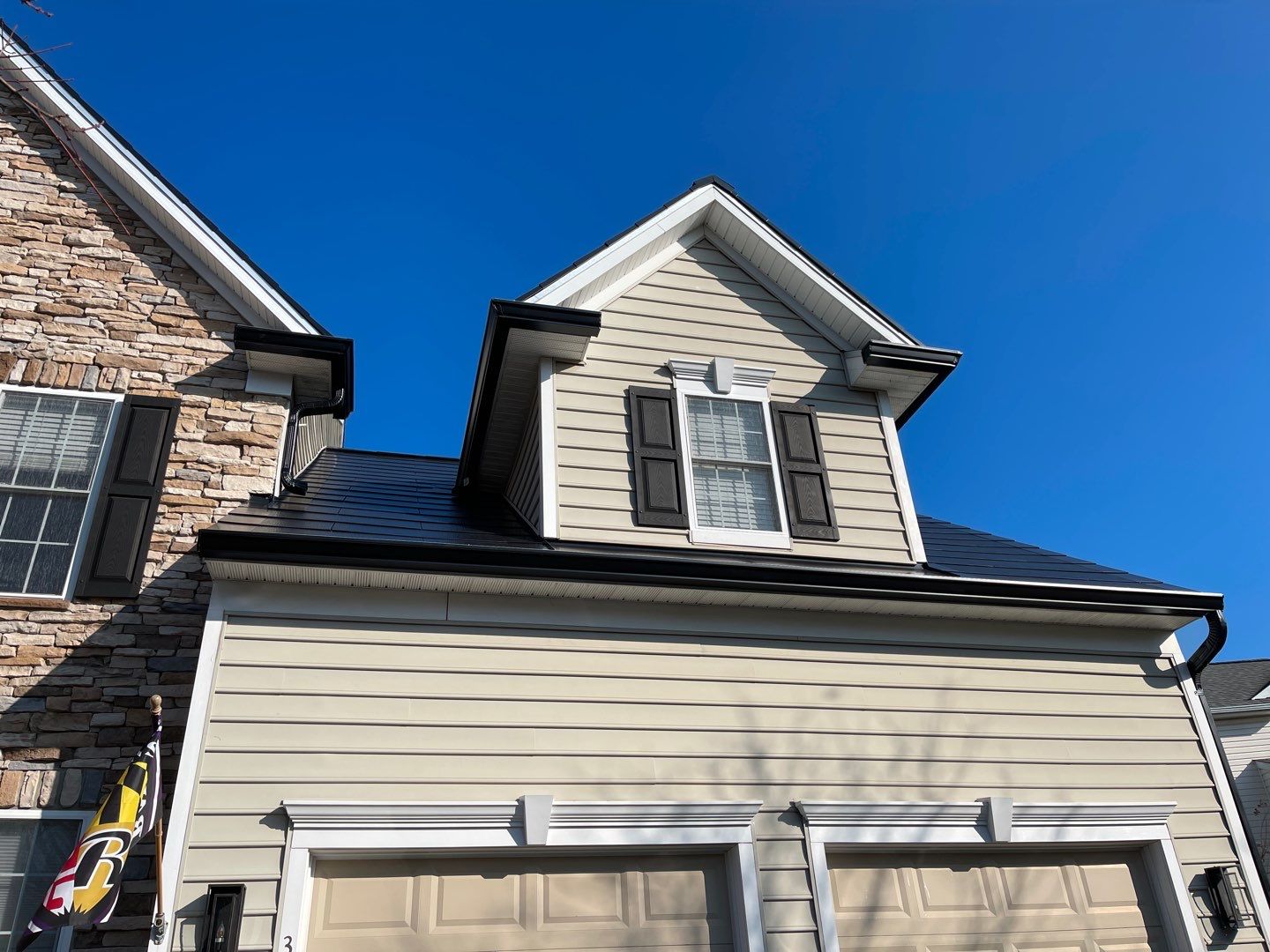 Tesla Solar Roof and Gutter Installation by American Home Contractors
