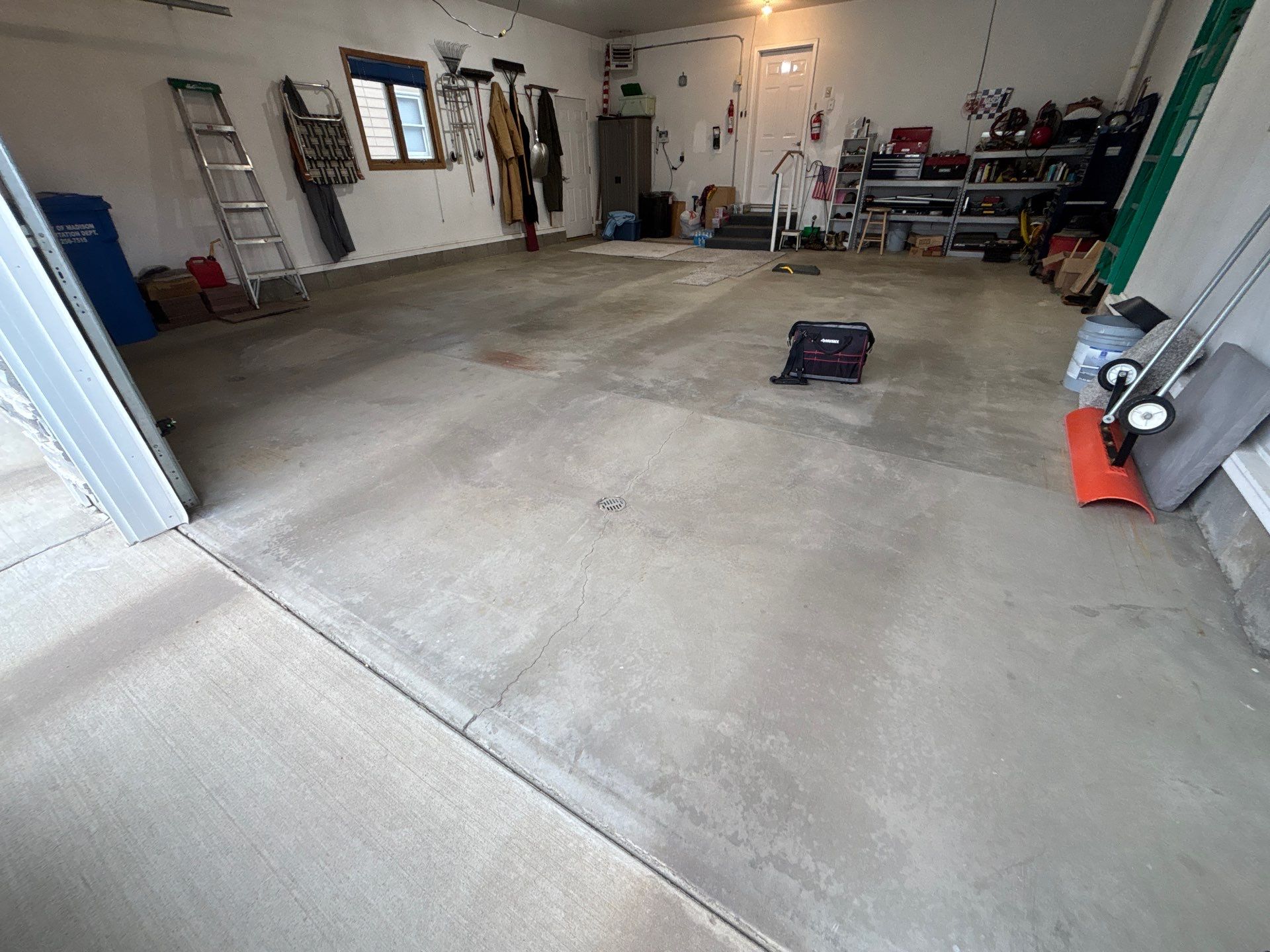 Madison Garage Concrete Coating with Feather Grey Speckle Finish by Select Painting, Coatings & Garage Cabinets