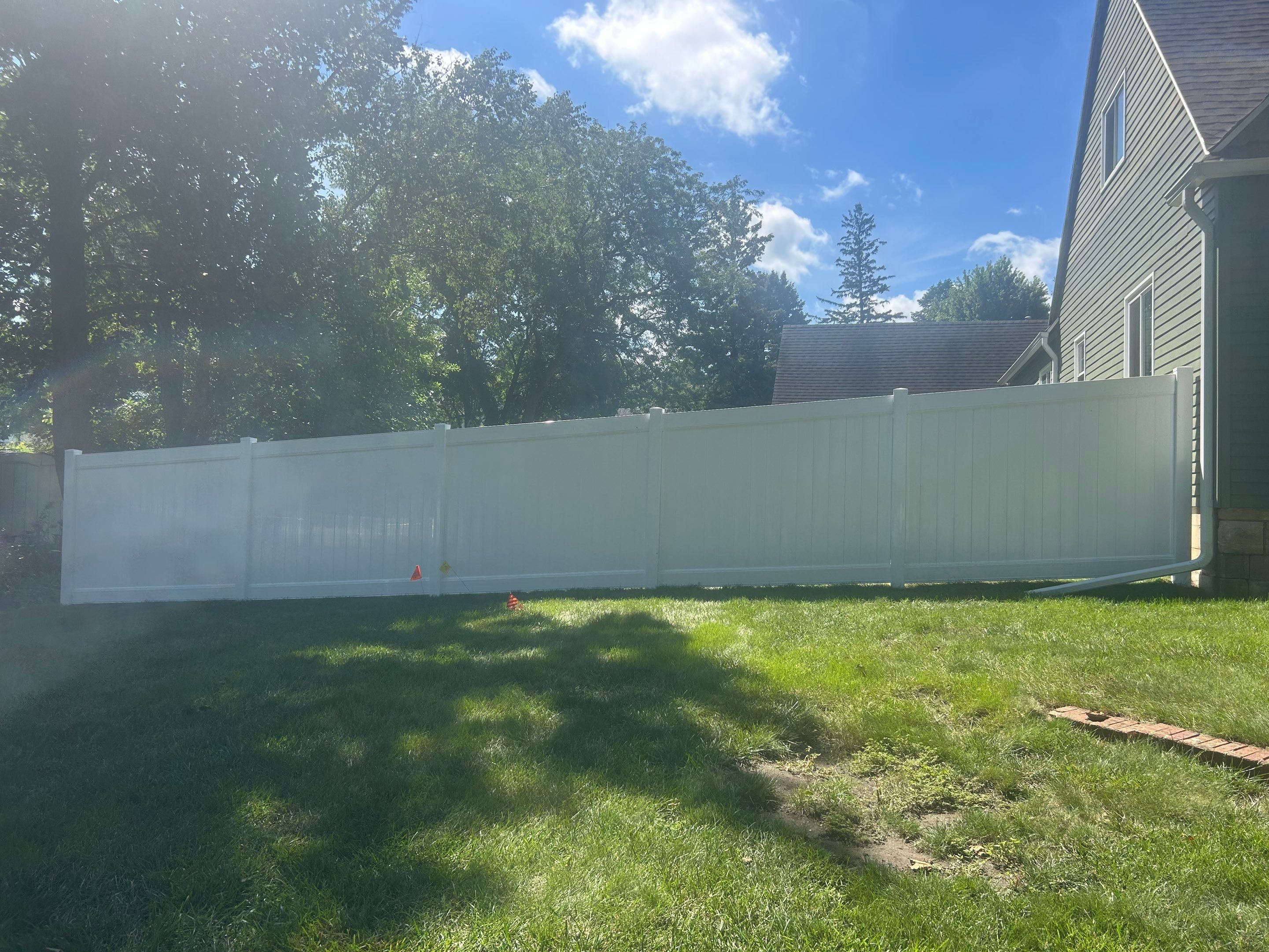White Vinyl Privacy Fence Installation in Aplington, Iowa by Perfect Picket Fence and Stain